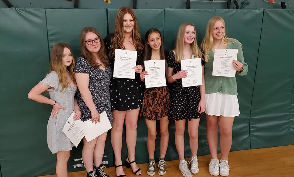 njhs students holding certificates