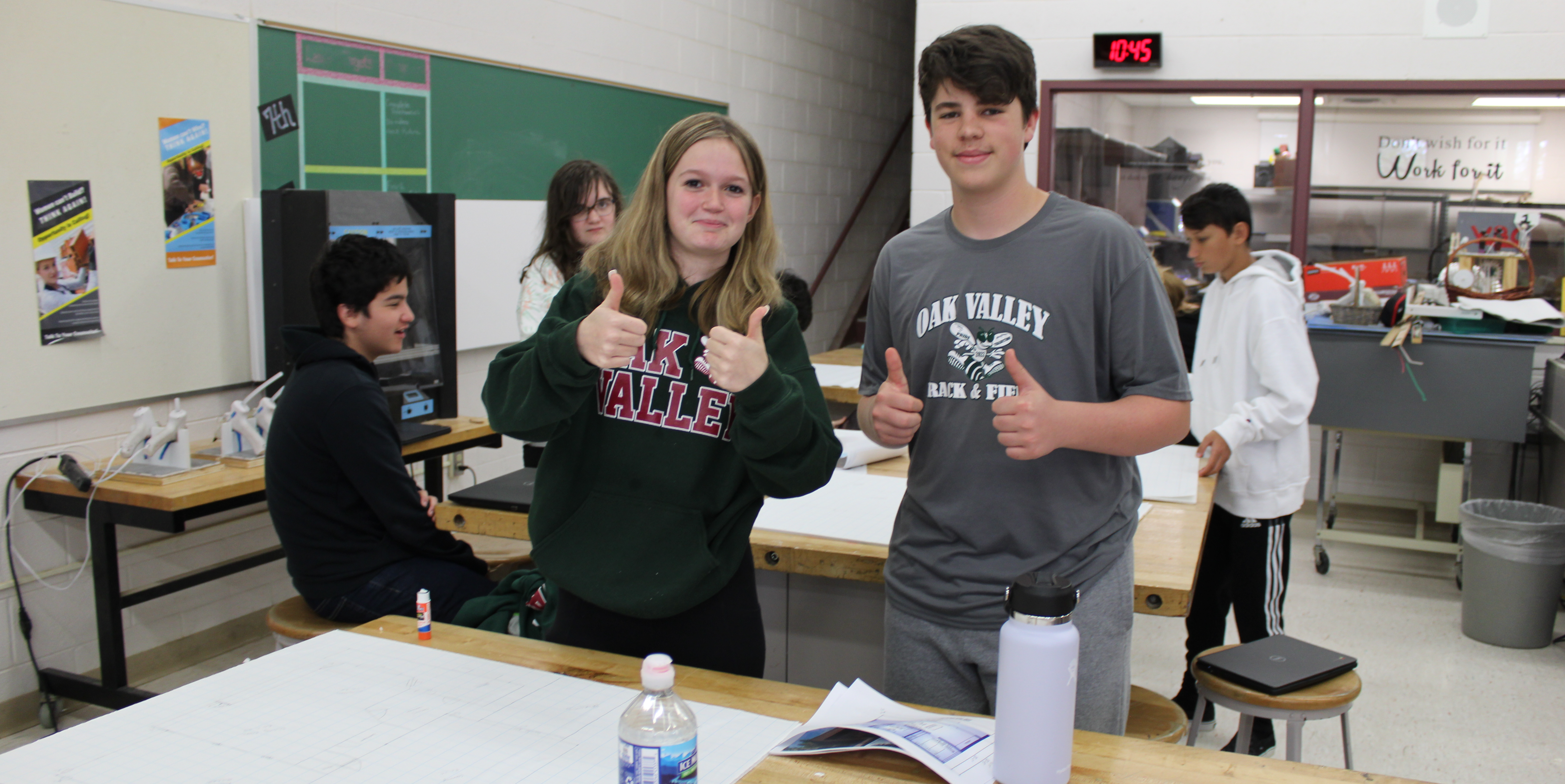 Students in engineering class giving thumbs up