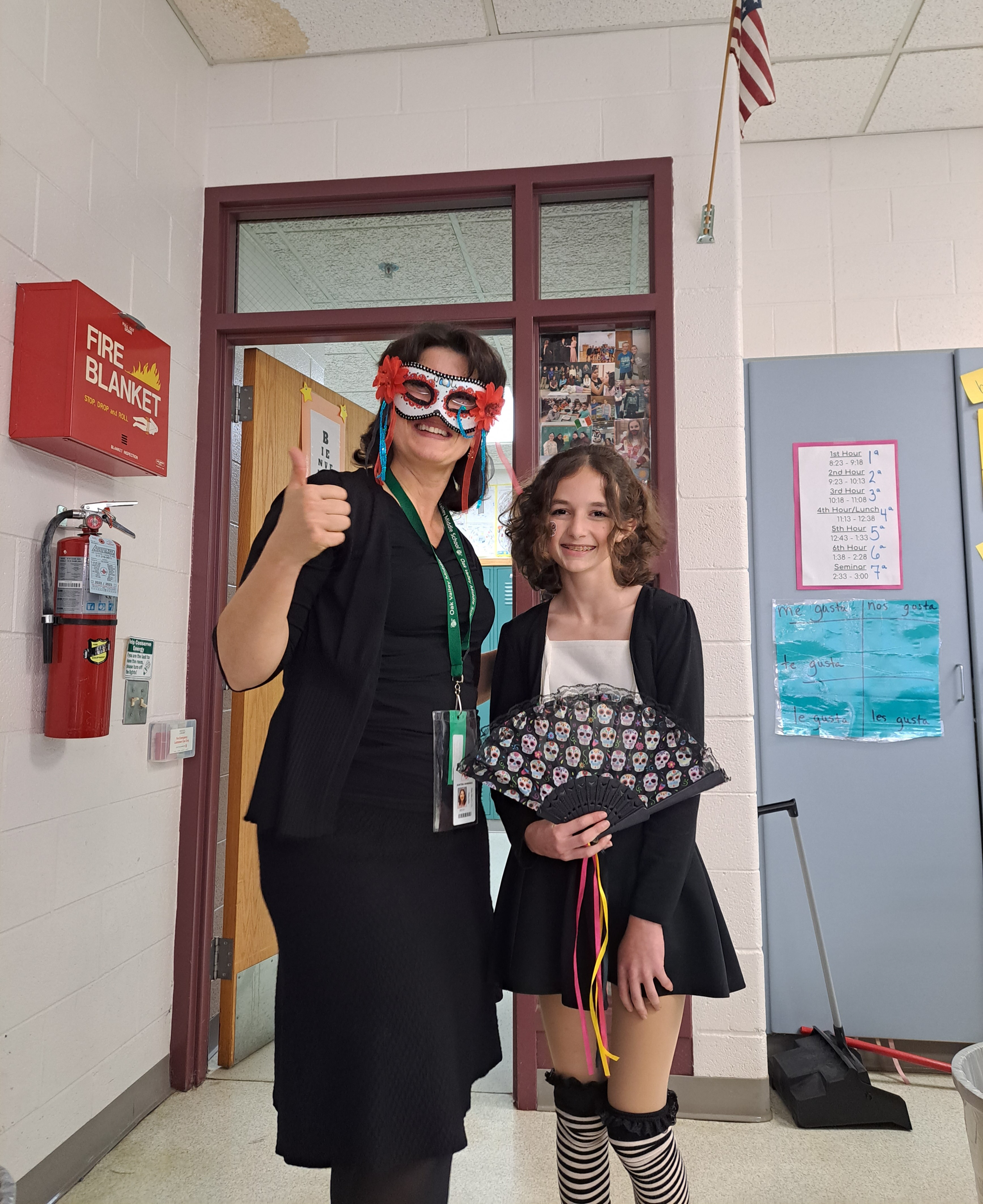 teacher and student dressed up for Dia de los Muertos