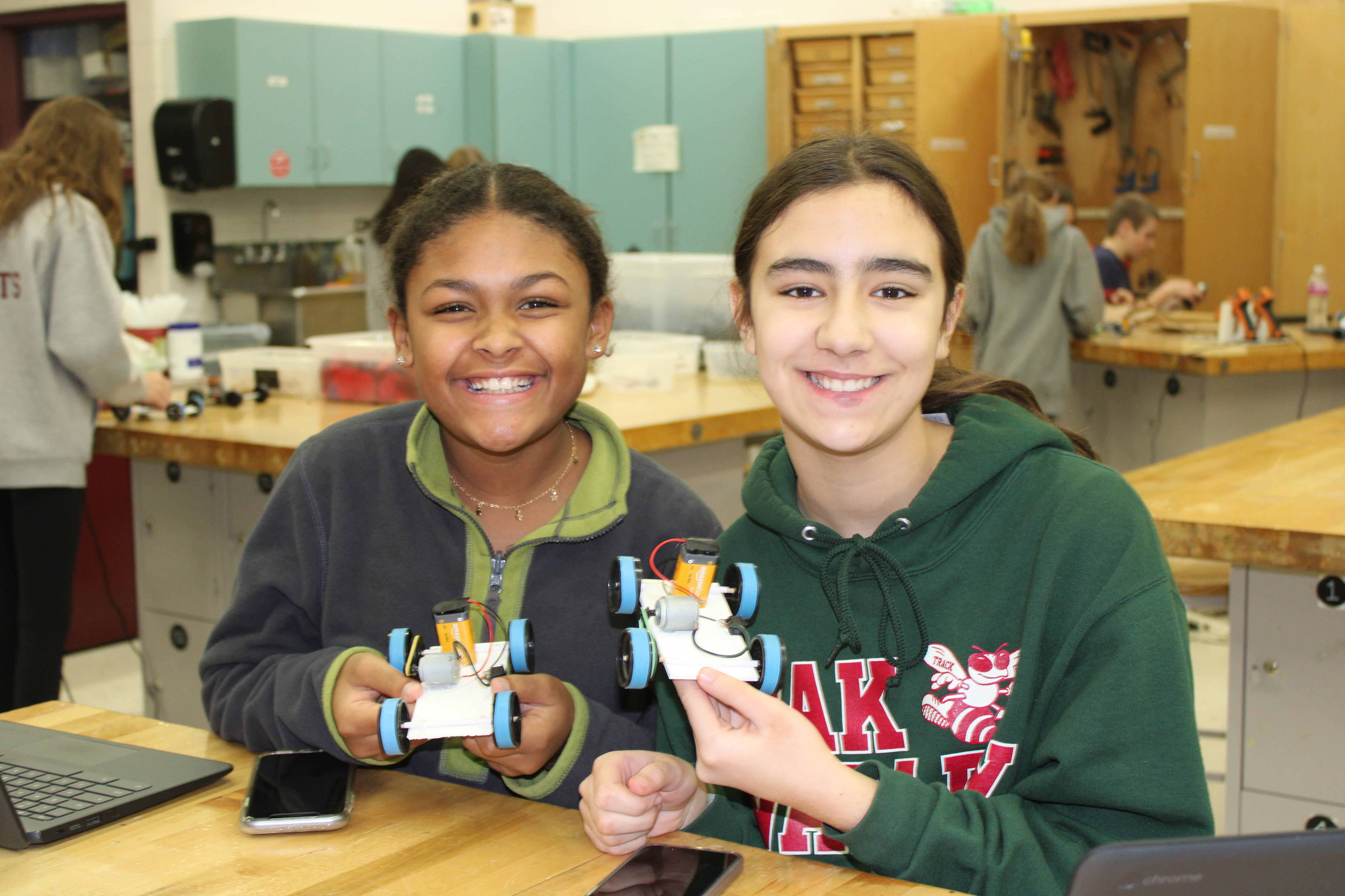 Two girls with car  project for  Engineering class