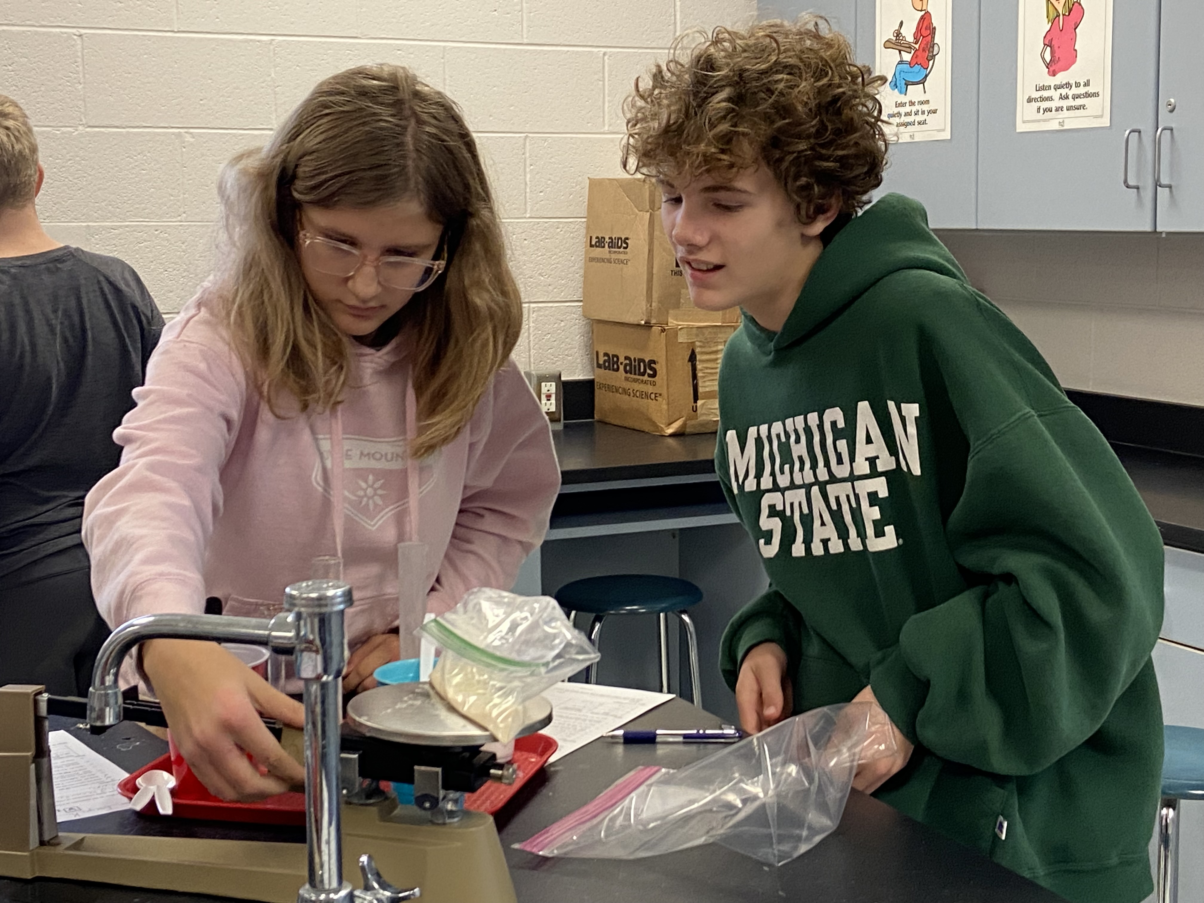 girl and boy working in science lab