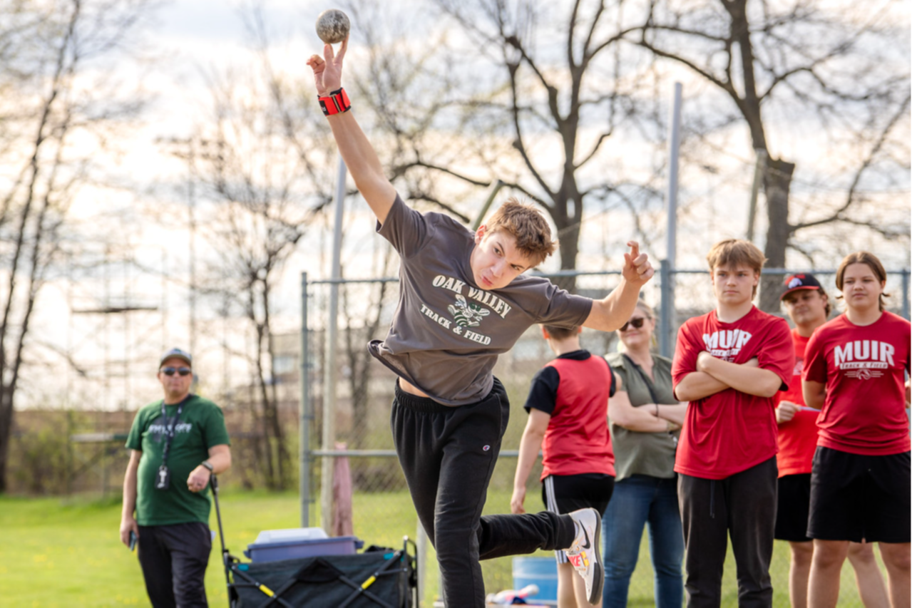 boy throws the shotput