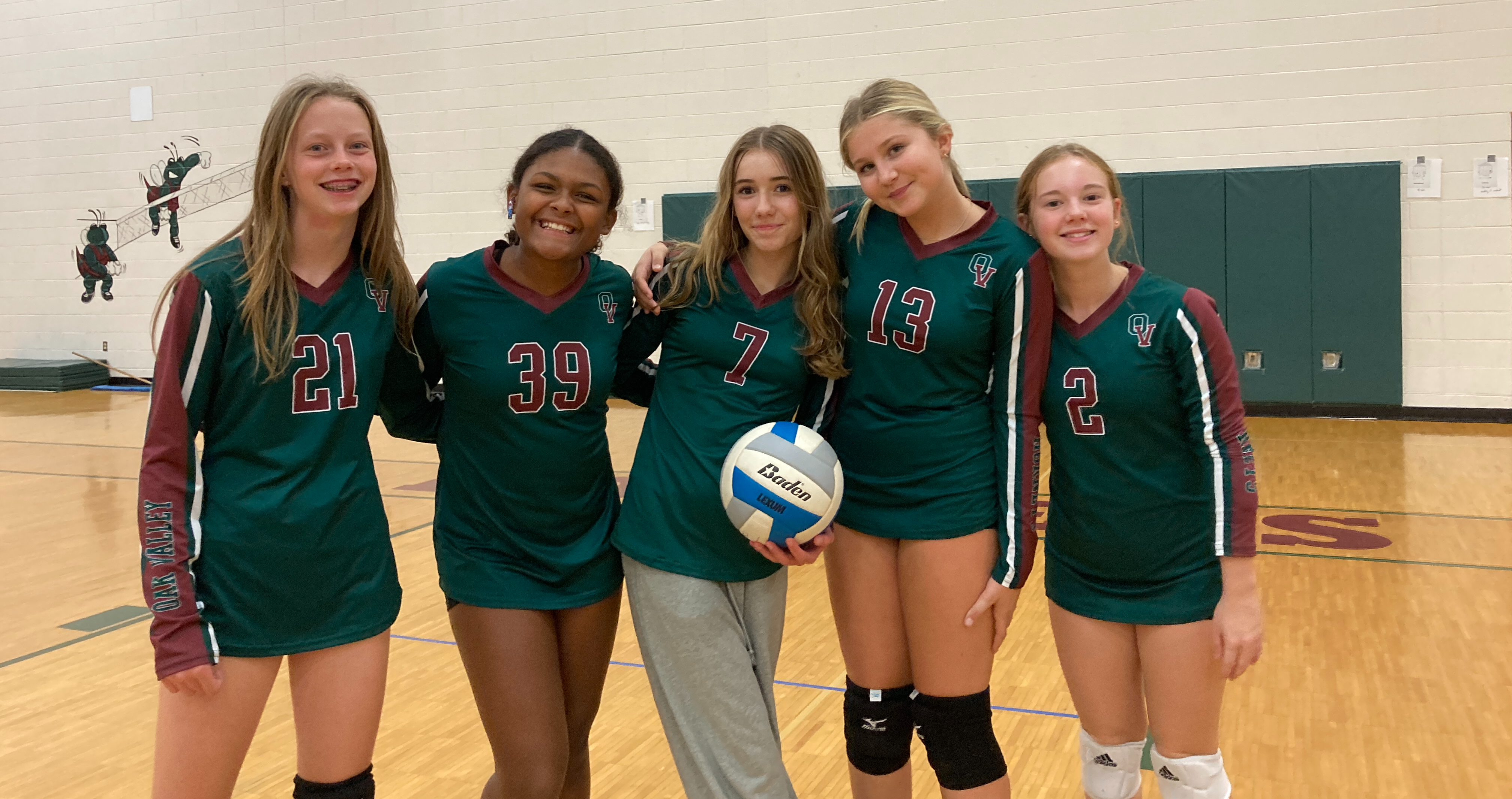8th grade players with volleyball