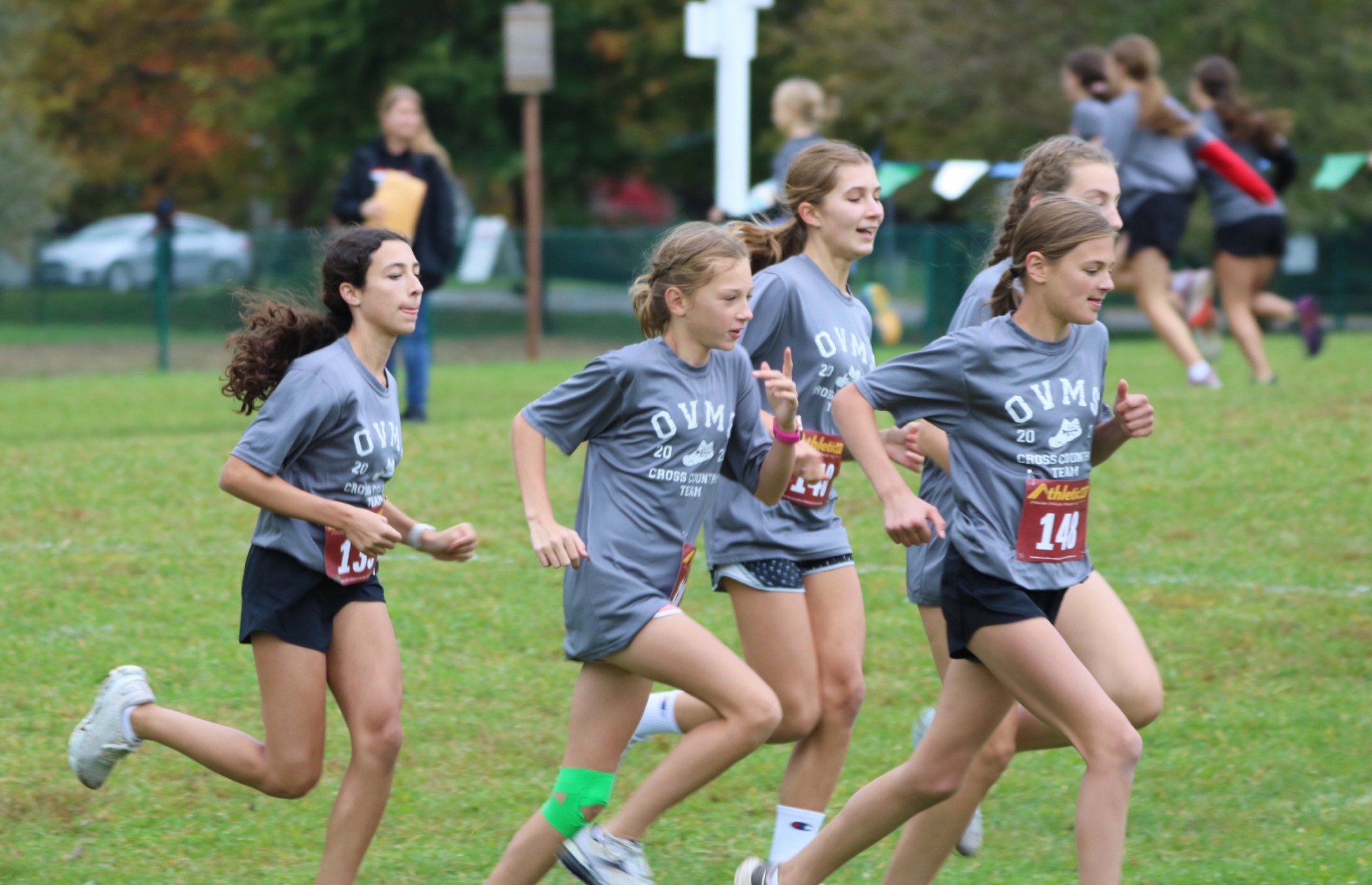 girls running in cross country race