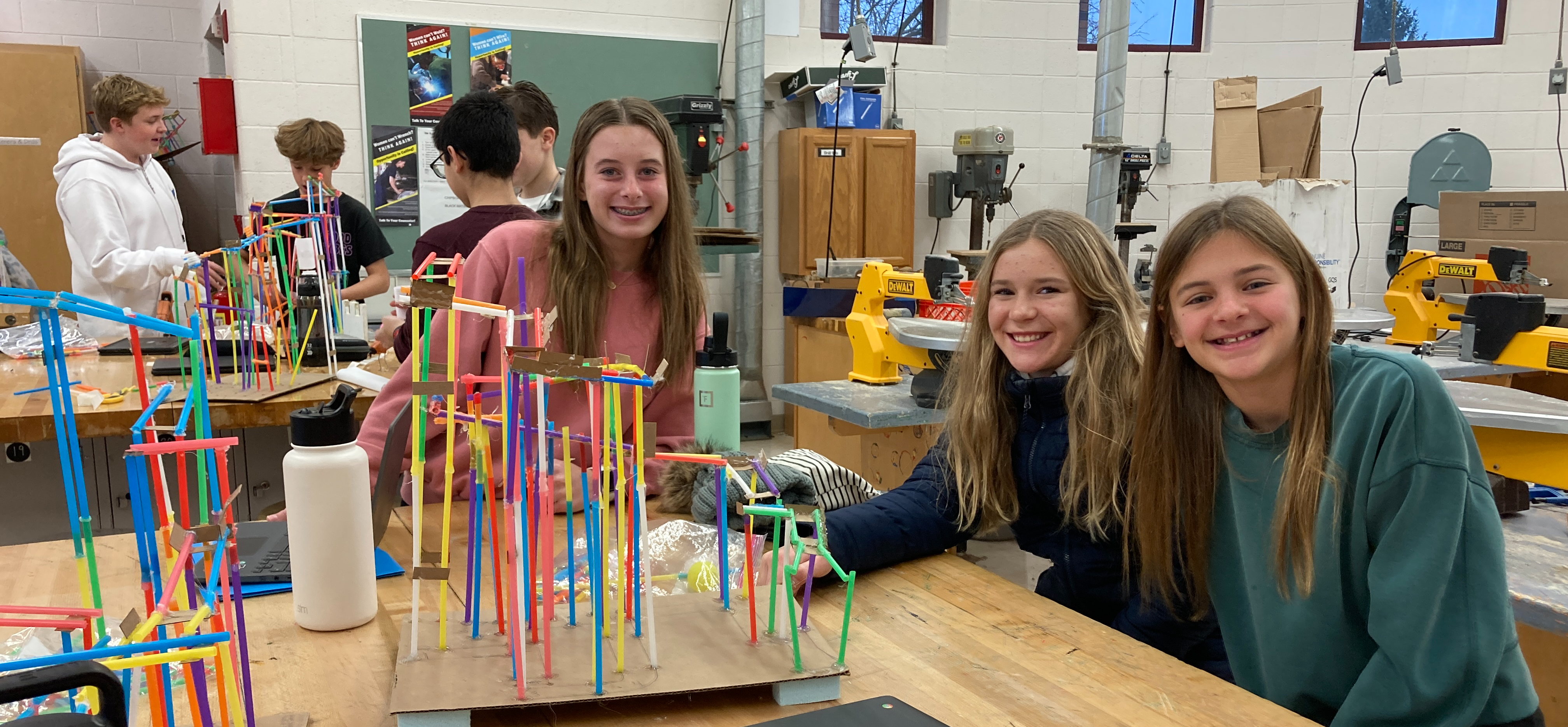 students make roller coasters with straws