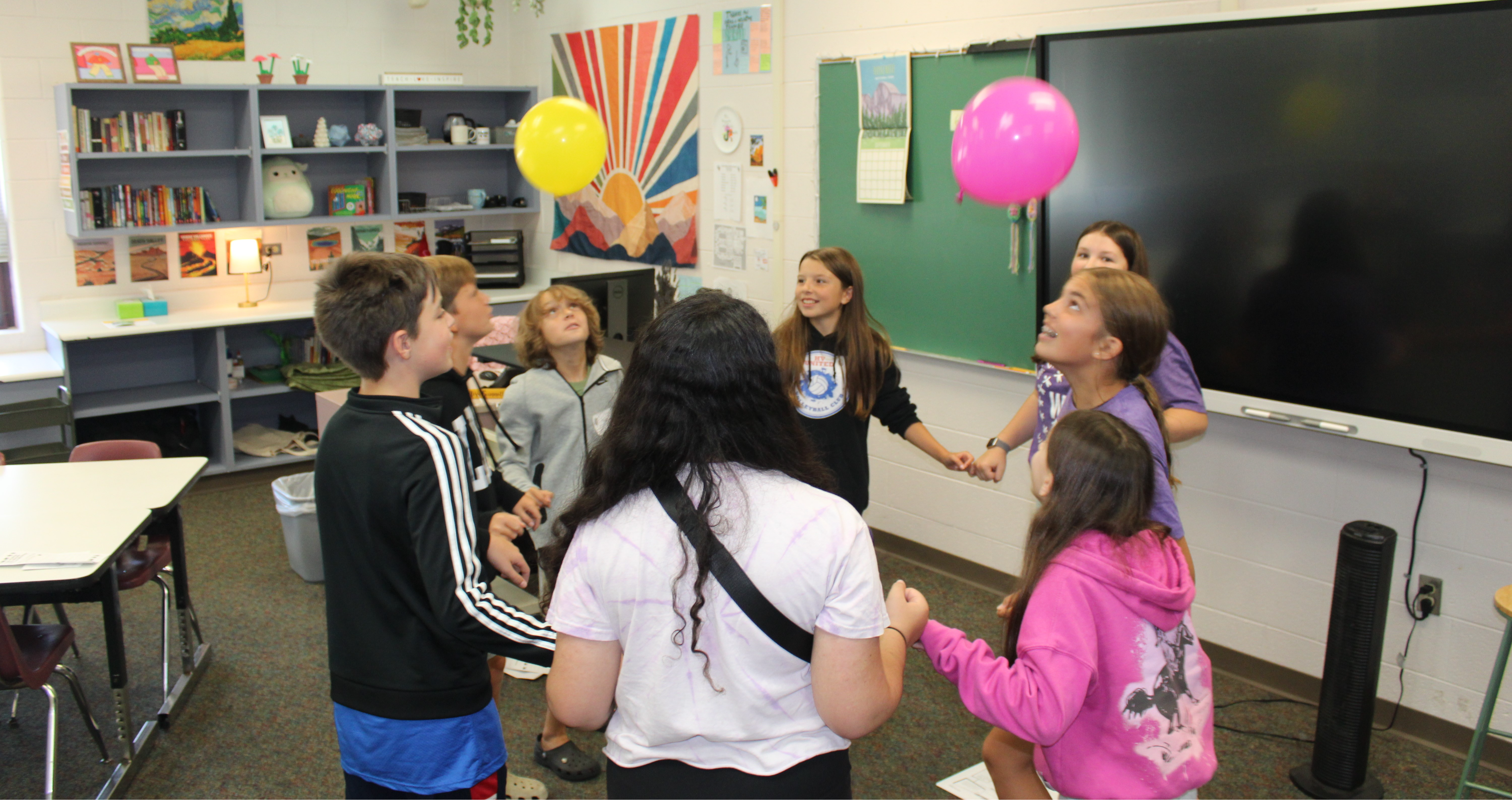 Leaders play balloon game with students