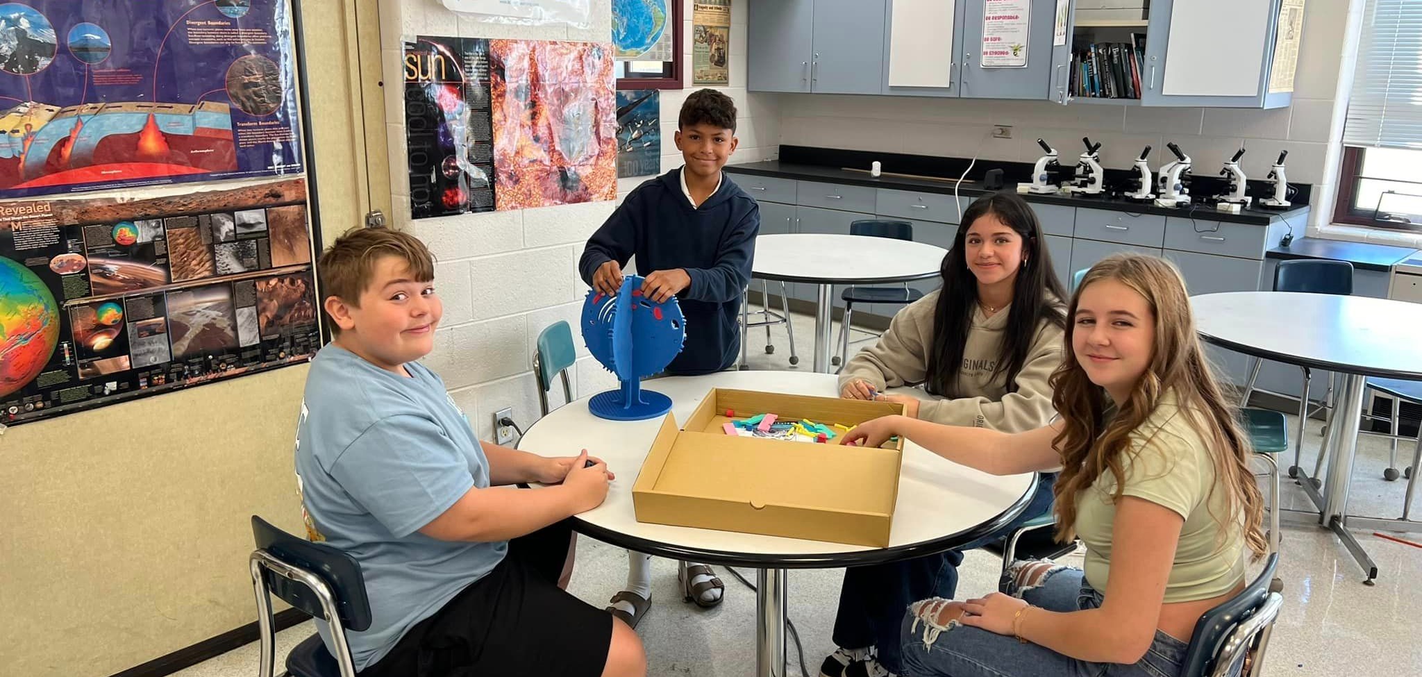 science students construct a model of a cell