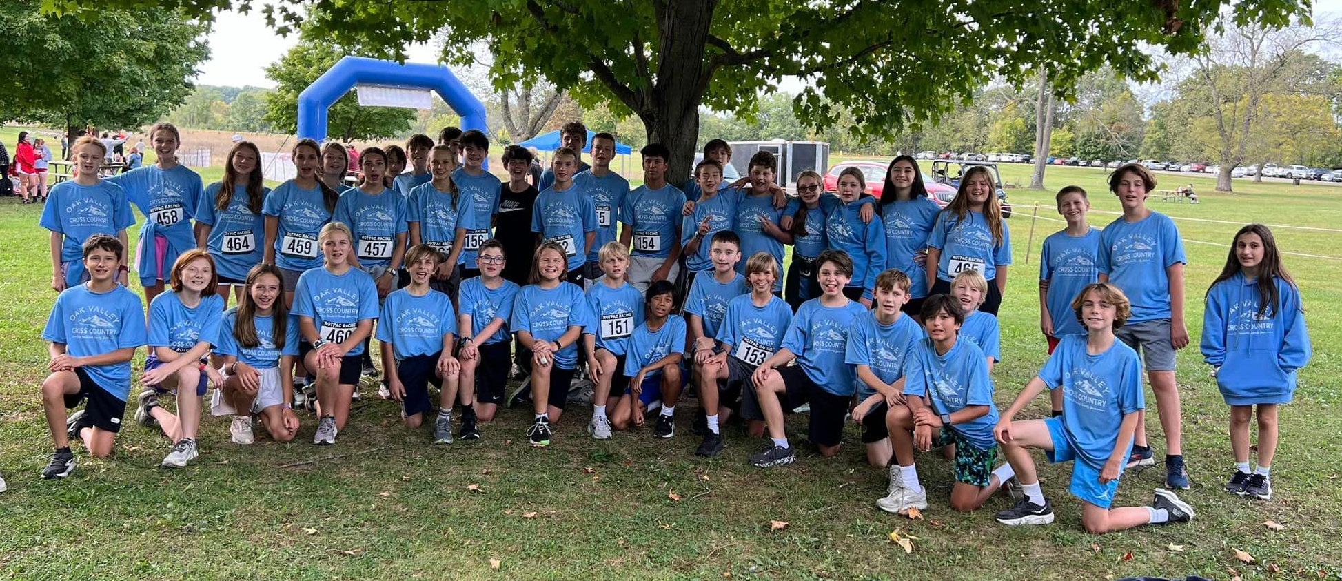 Cross Country  team poses outdoors