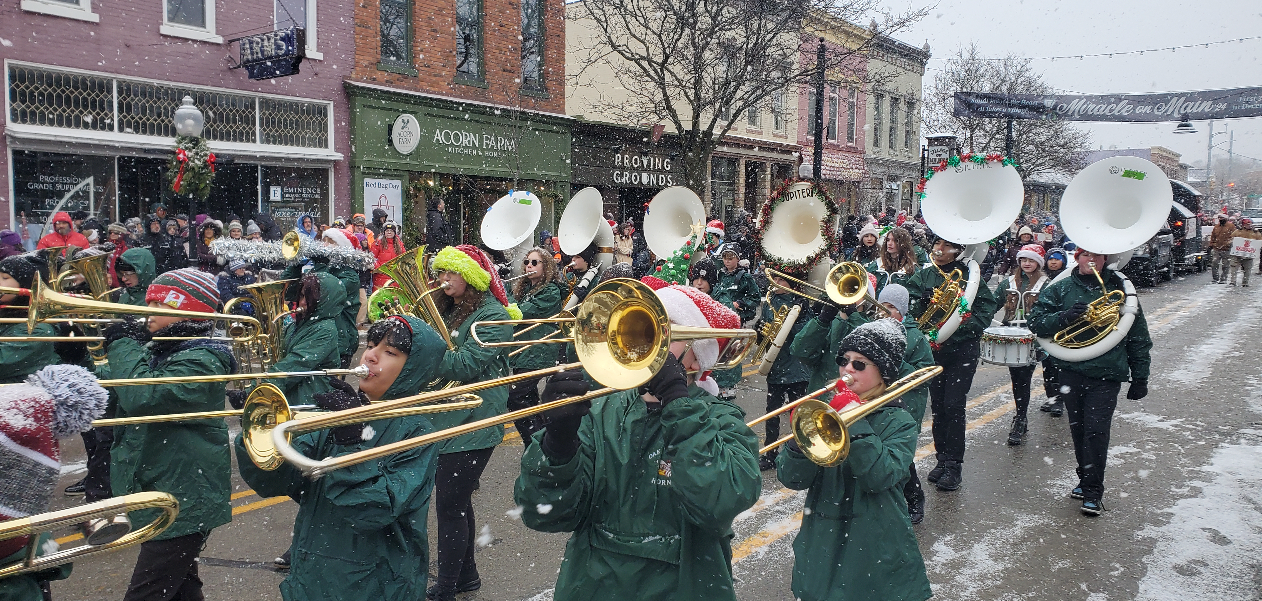 band marches in parade during snow