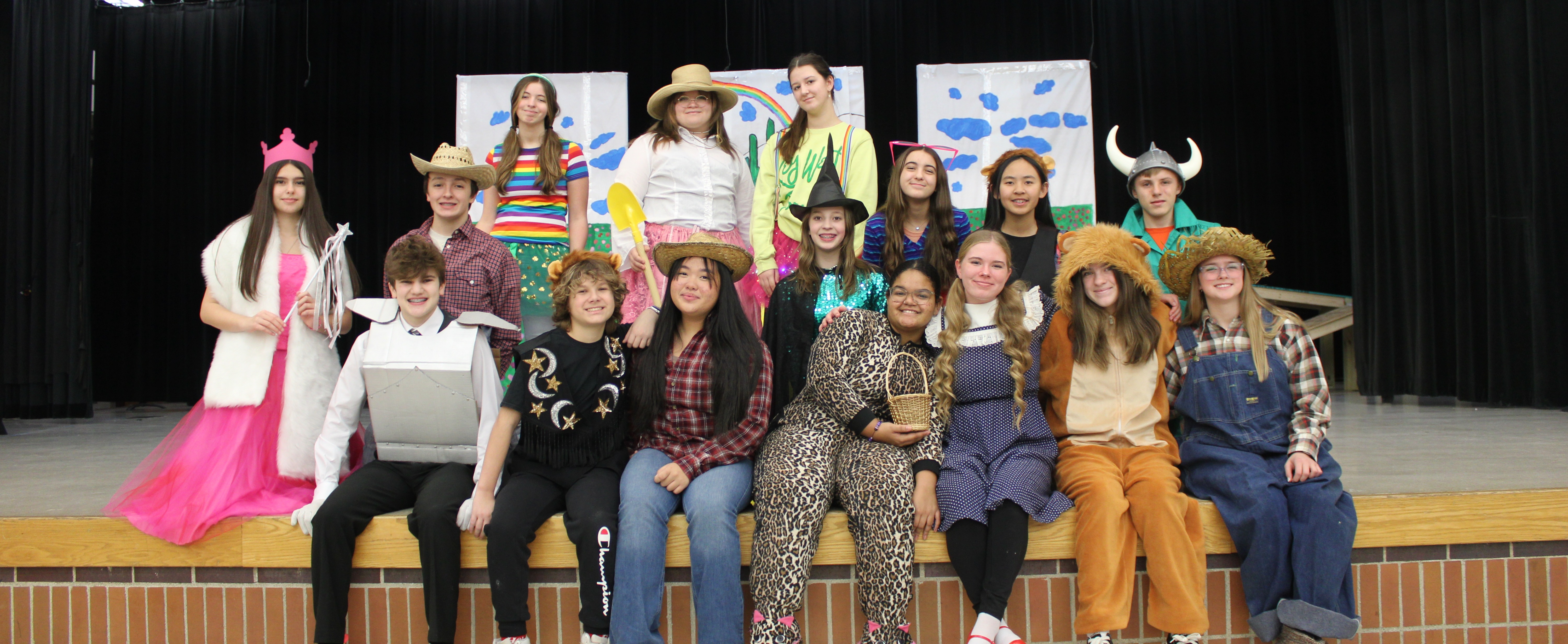 theatre students wear costumes for Wizard of Oz