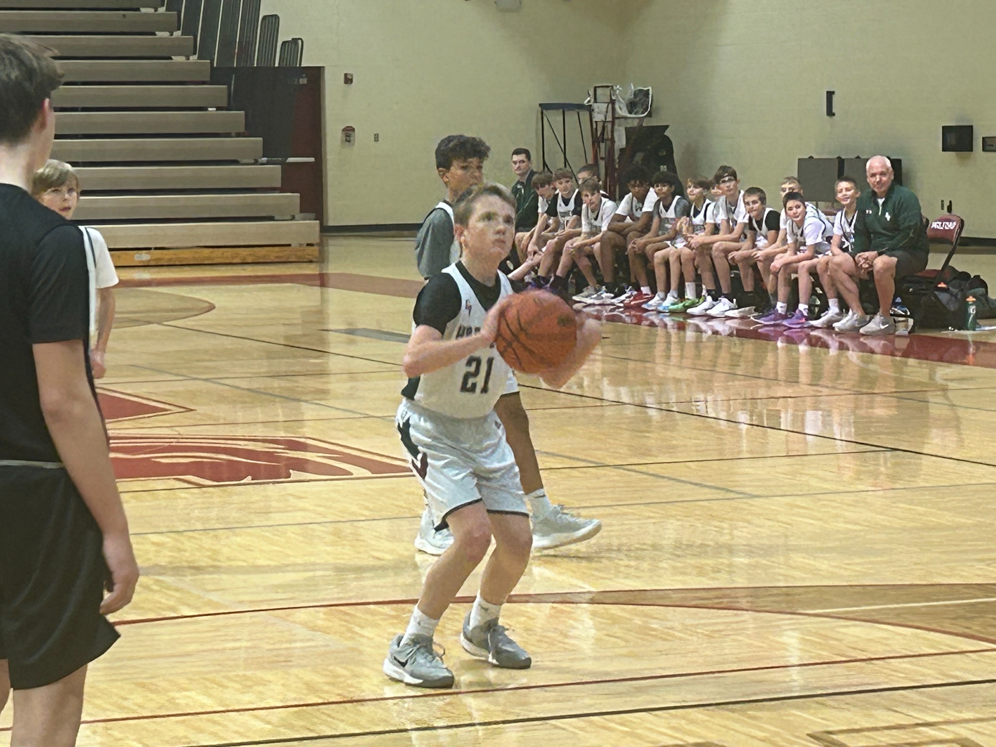 boy shoots a free throw