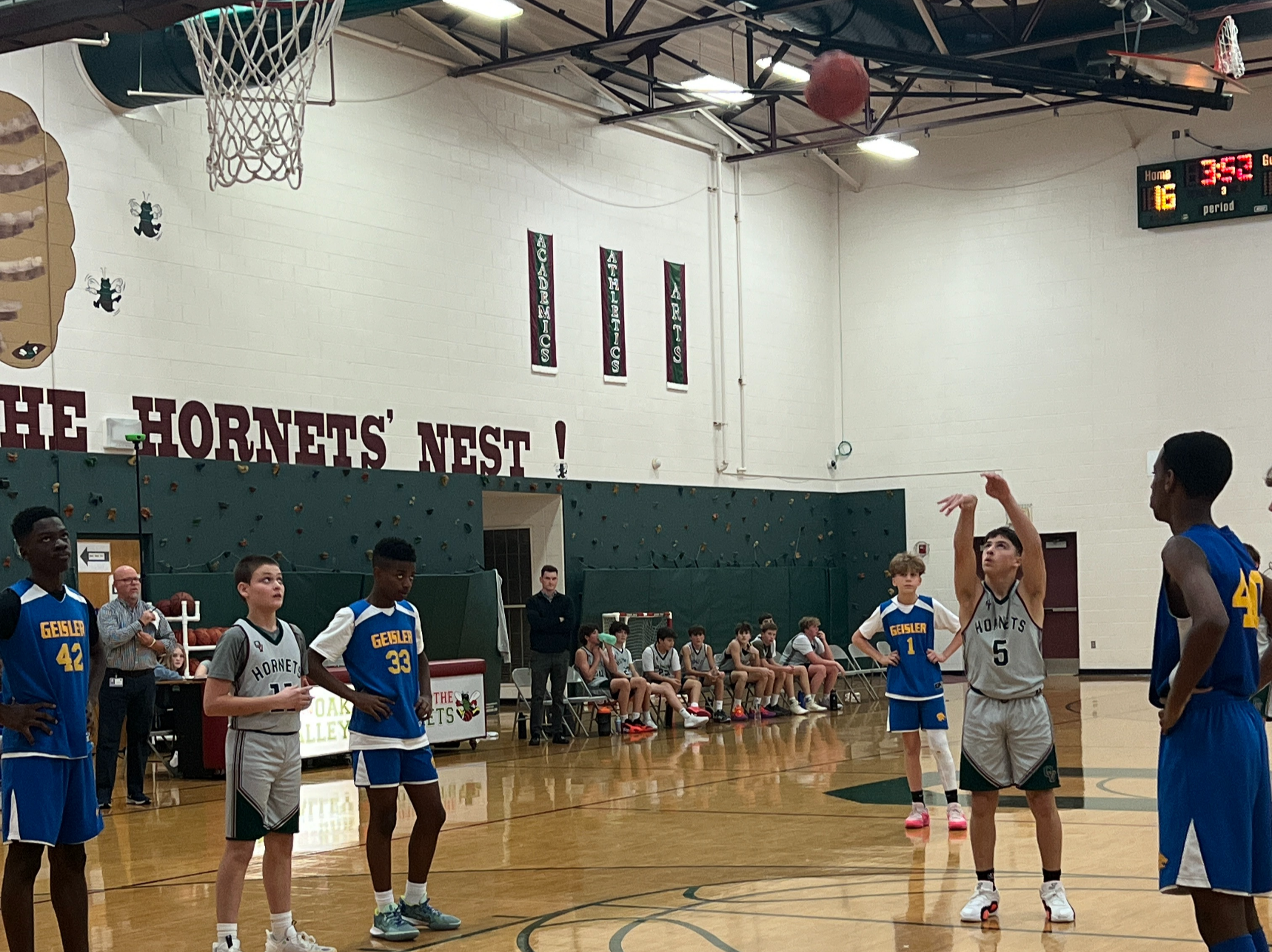 boy shoots free throw