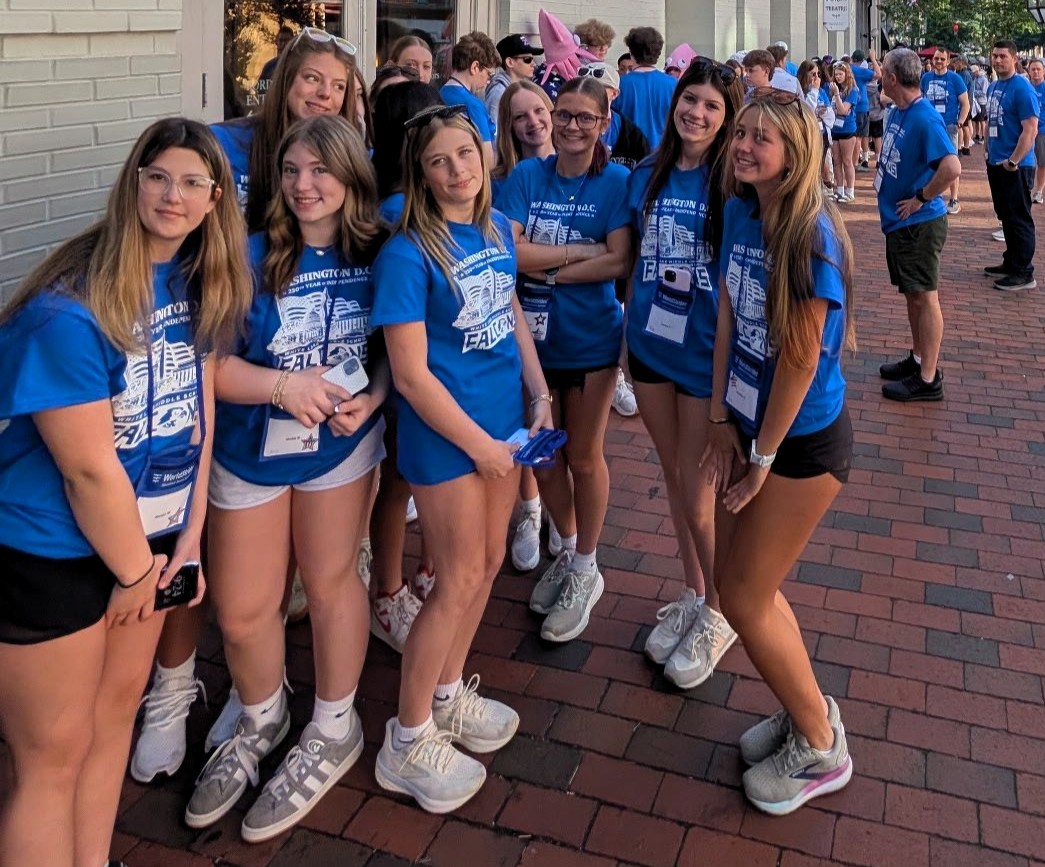 students in D.C. standing on street posing for photo