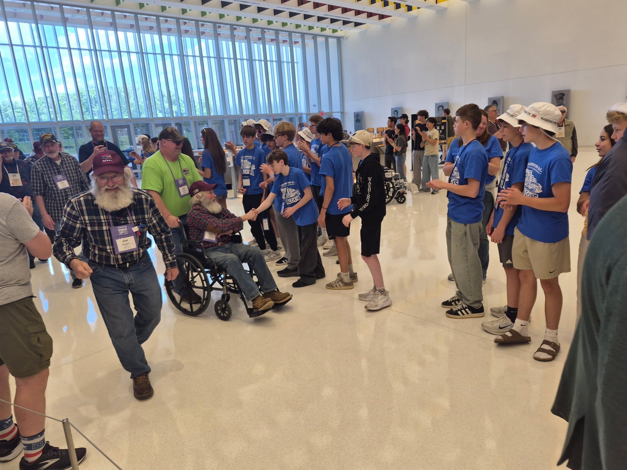 students greeting veterans in DC