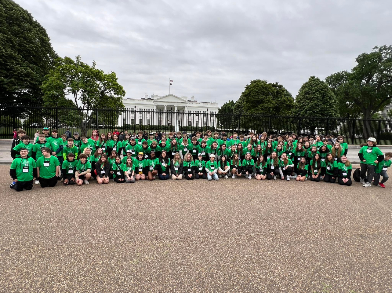 students pose for group photo outside in DC