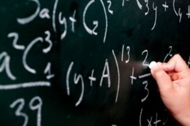 a chalkboard with math problem it