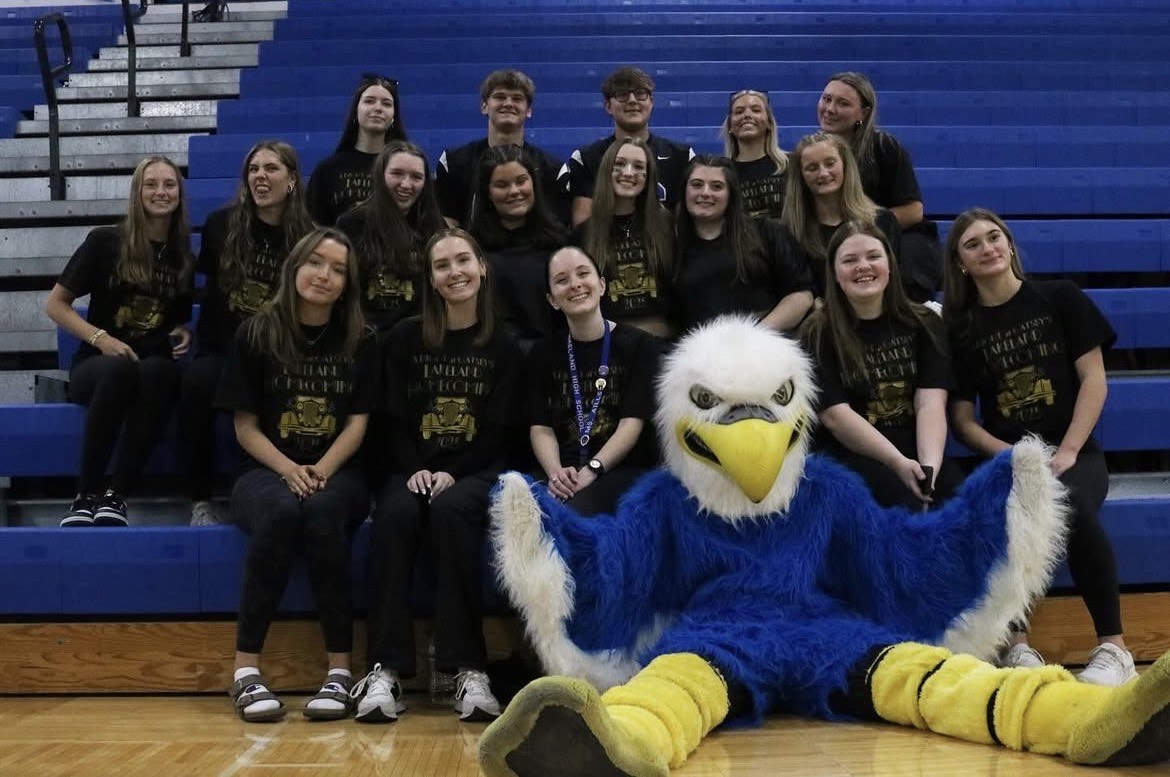 Group of students in black with the Lakeland eagle in front