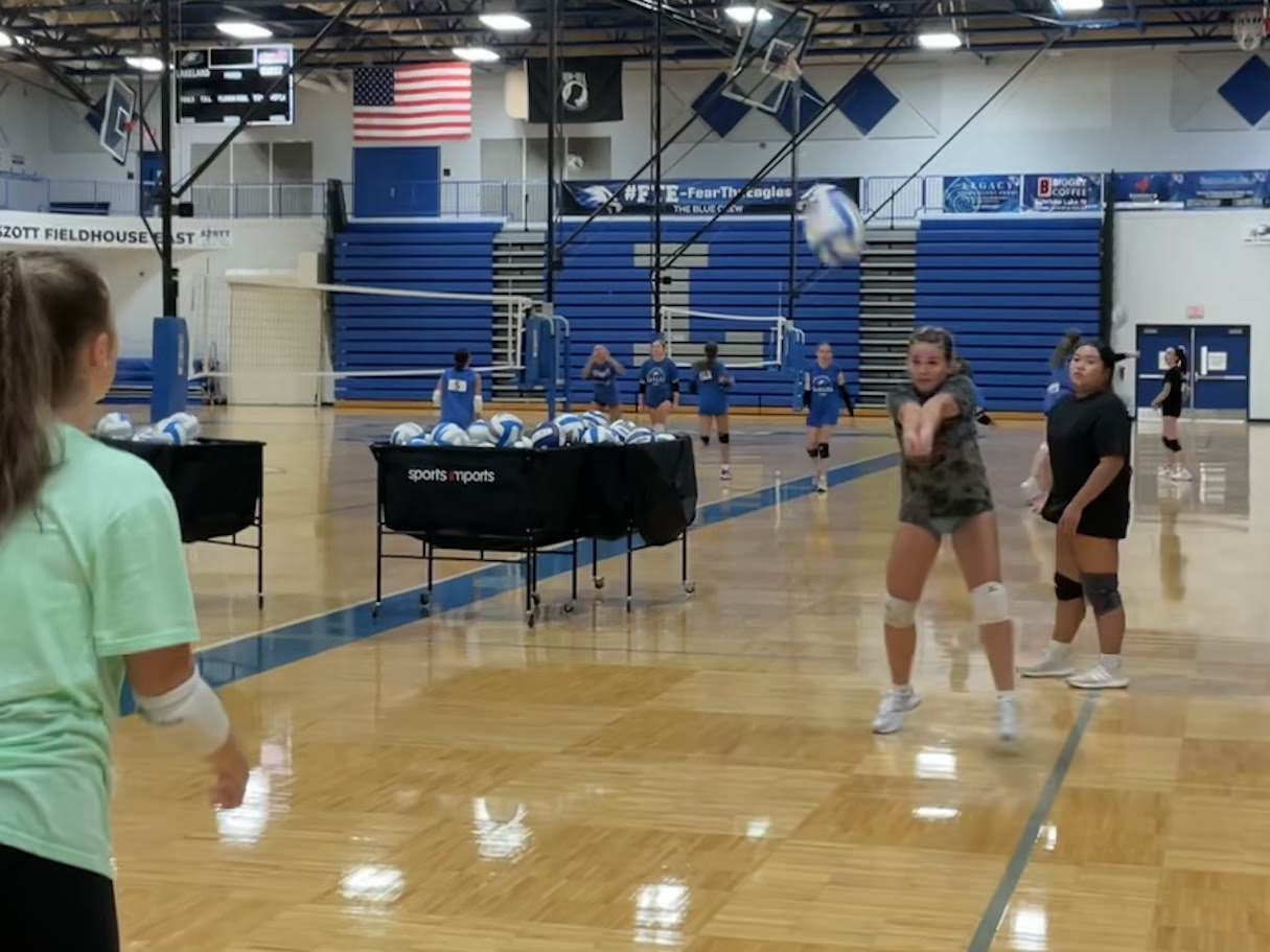 girl doing volleyball drills in gymnasium