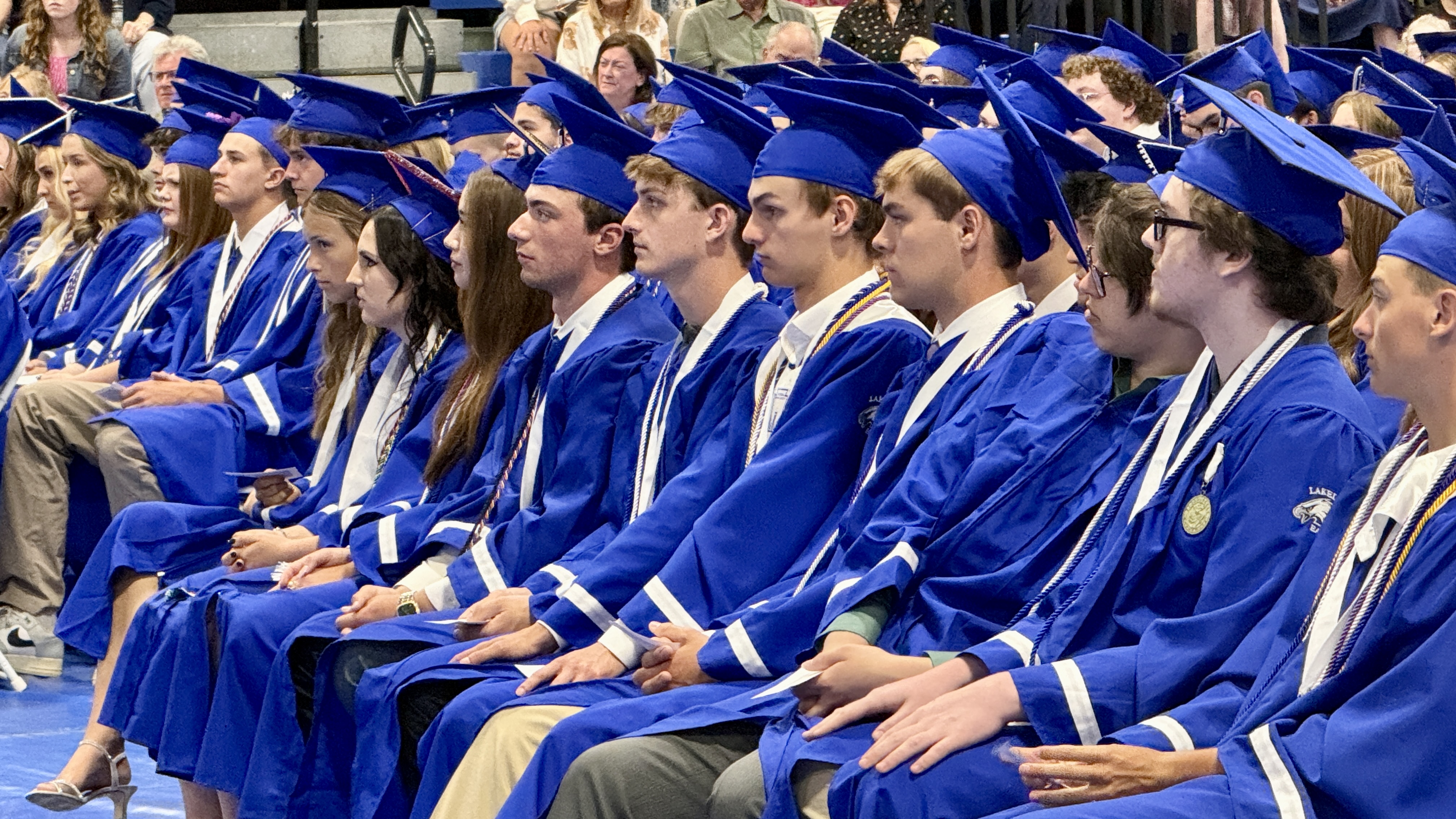 Students in cap & gown at graduation ceremony
