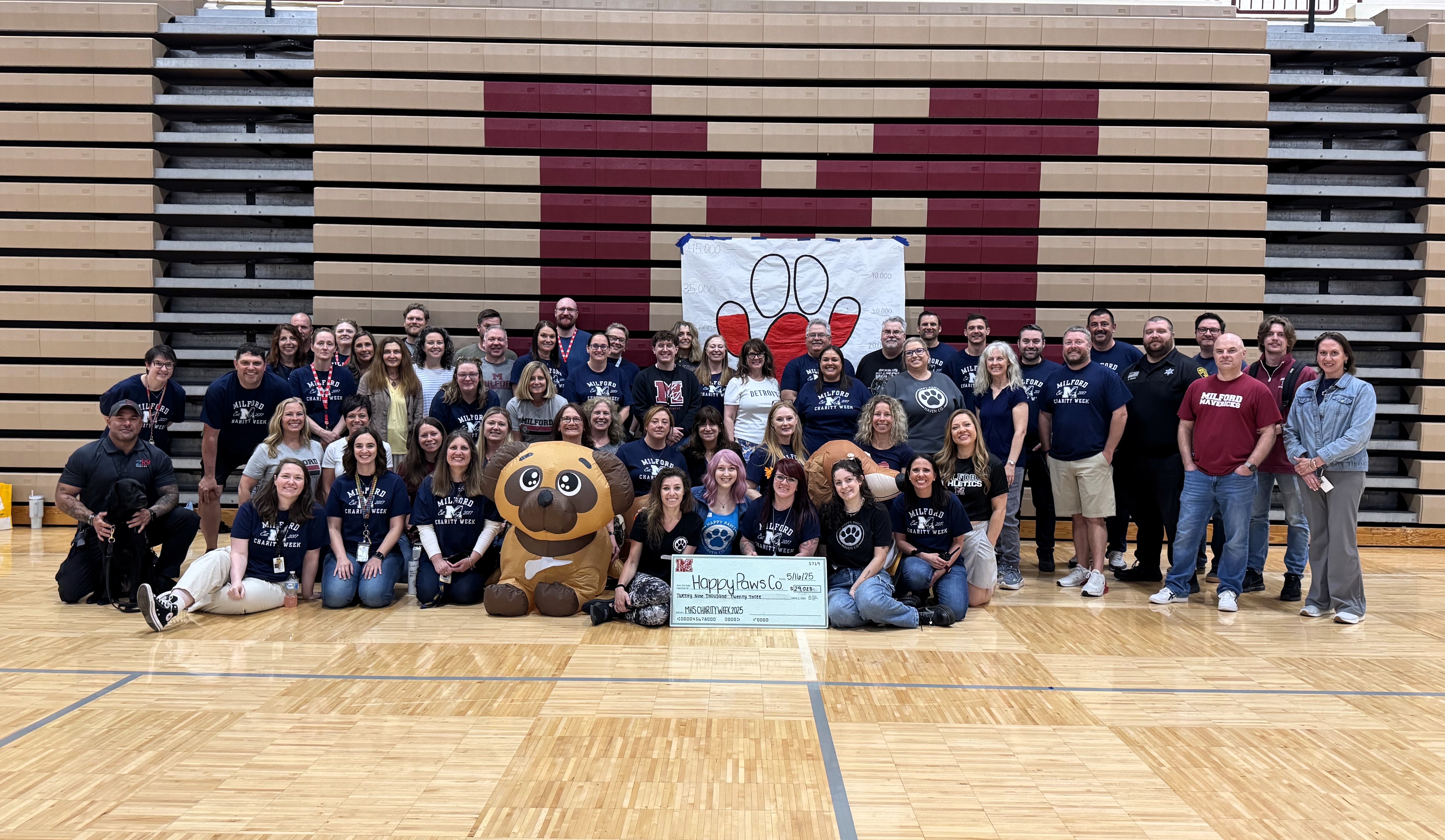 MHS staff pose with Happy Paws Charity.