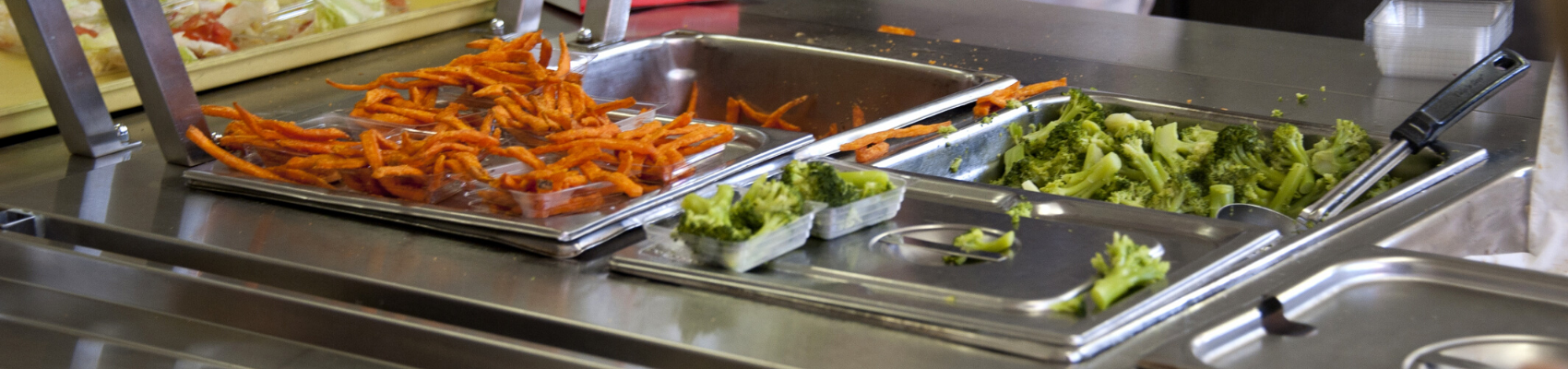 cafeteria line with broccoli  and sweet potatoes 