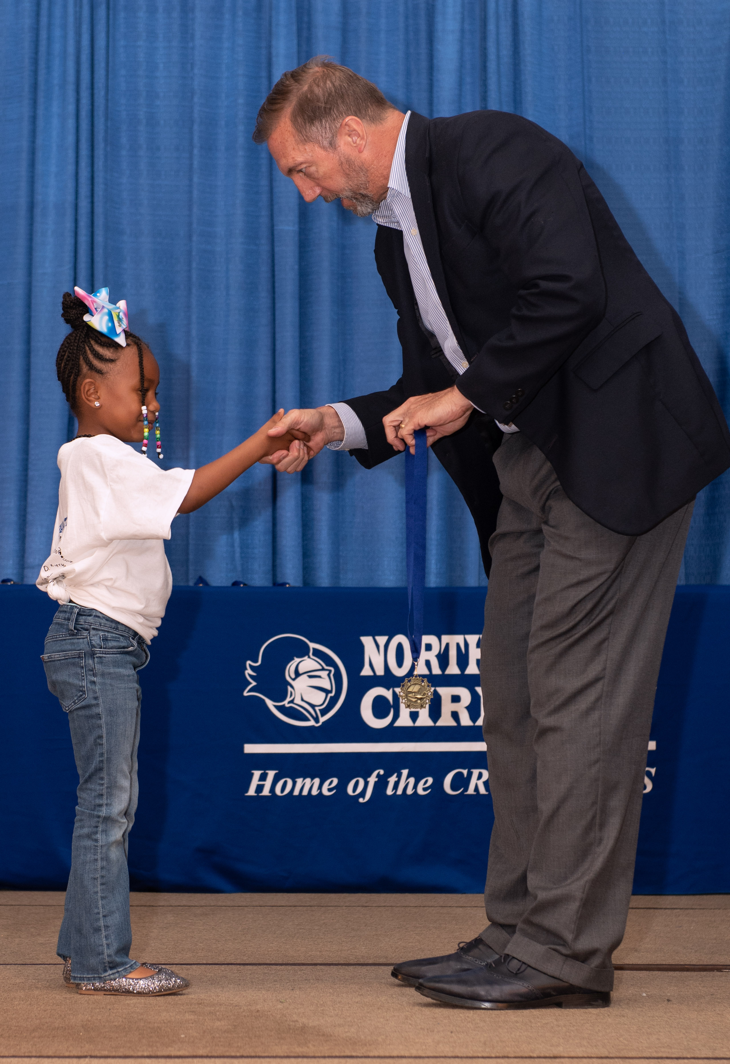 Dr. Clark giving award to student