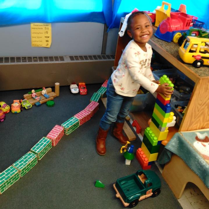 Girl playing with her toys