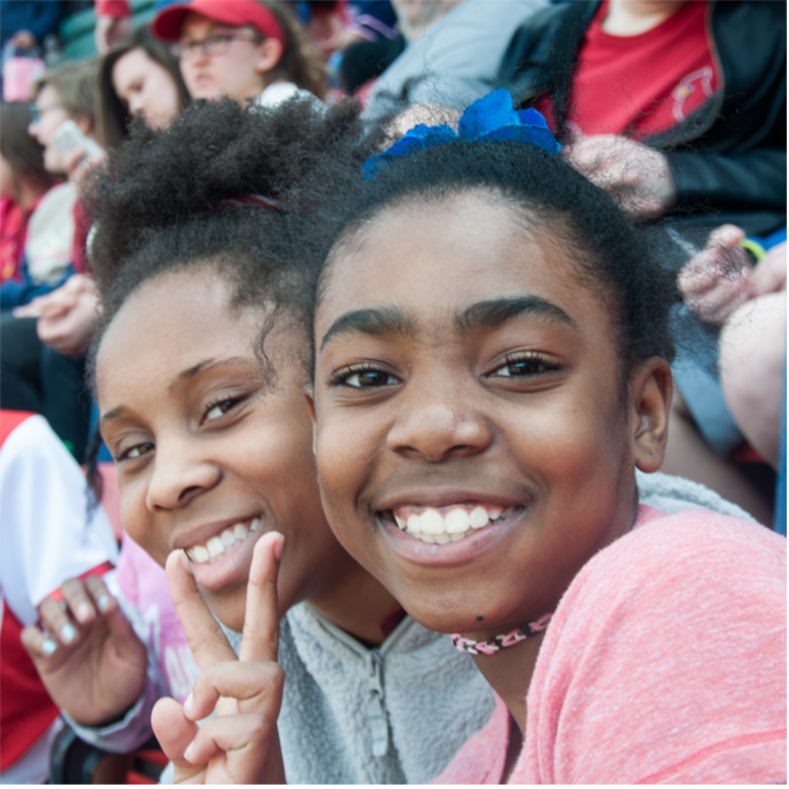 Two girls smiling at the camera