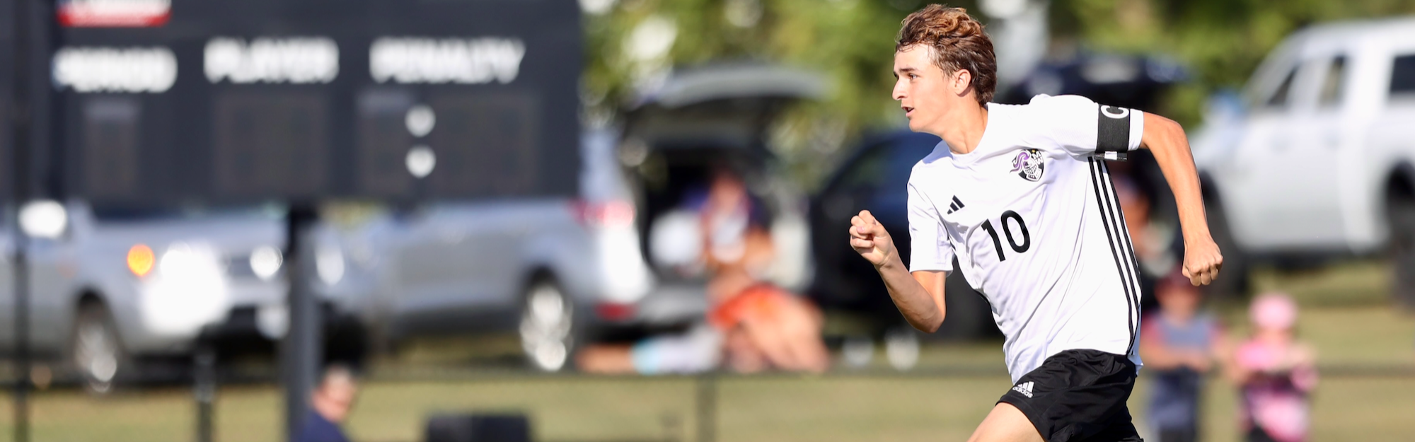 soccer player kicking the ball