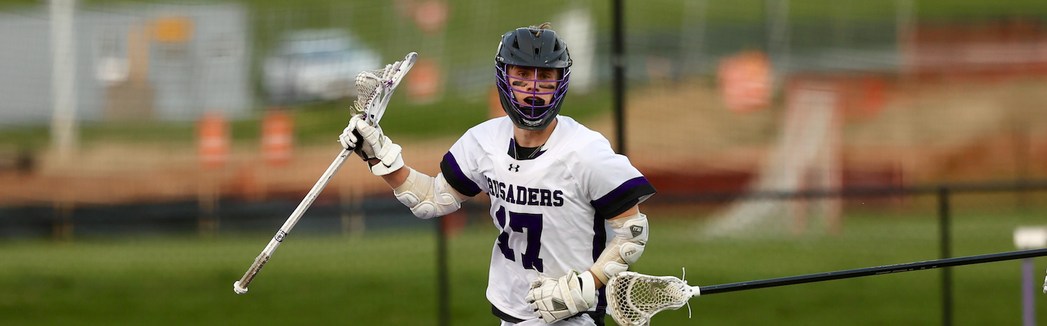 student with lacrosse stick 