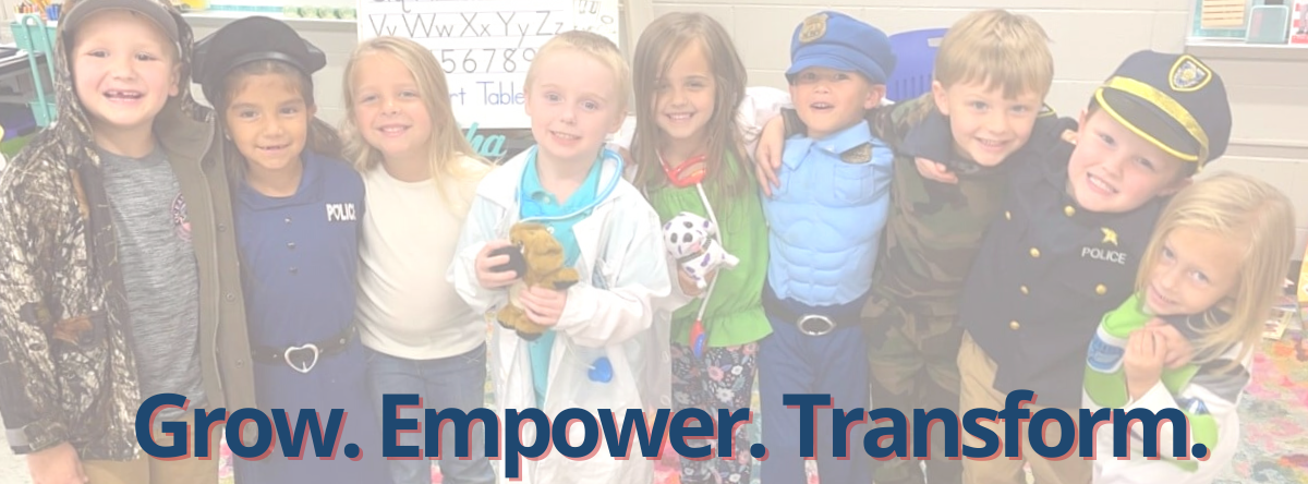Grow. Empower. Transform. Image of students standing in a group.