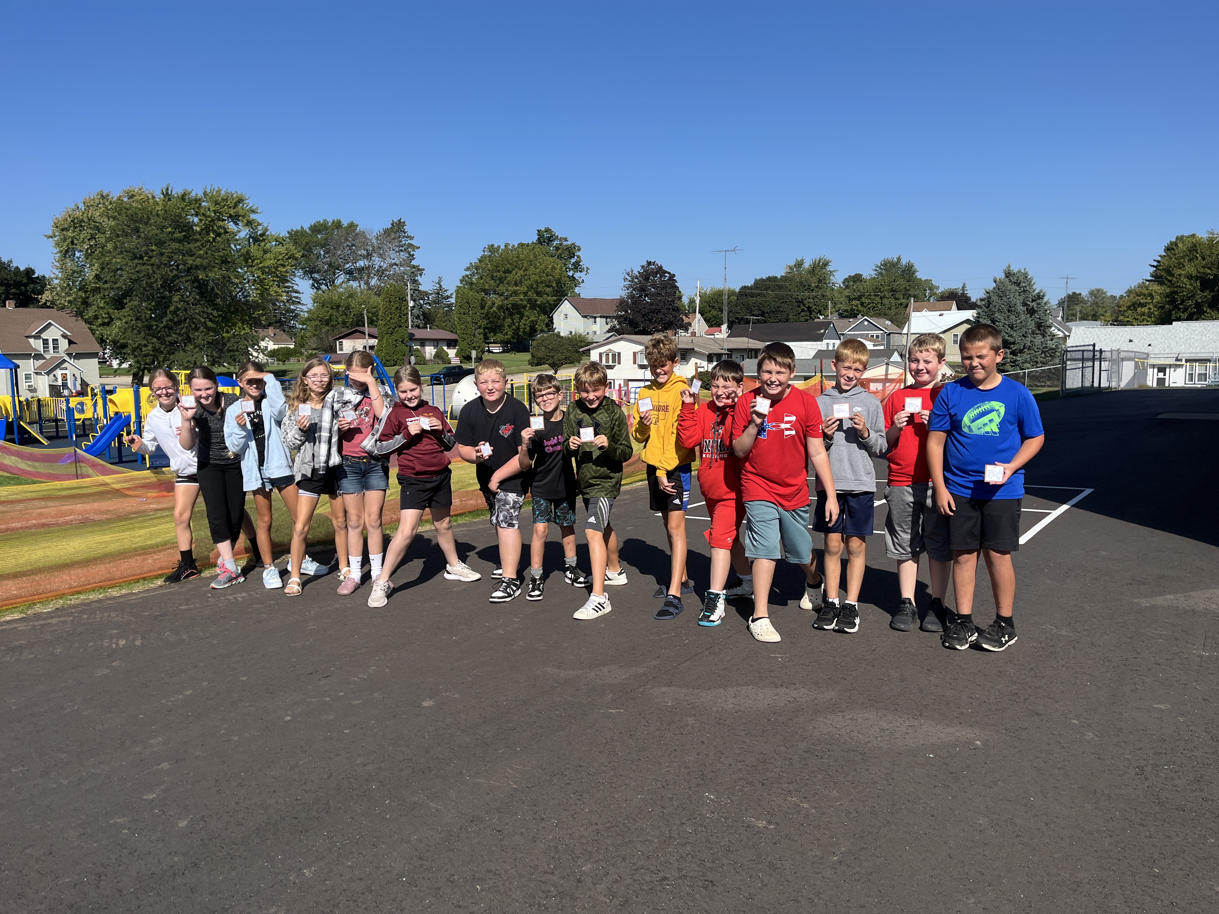 students in a line out on the playground