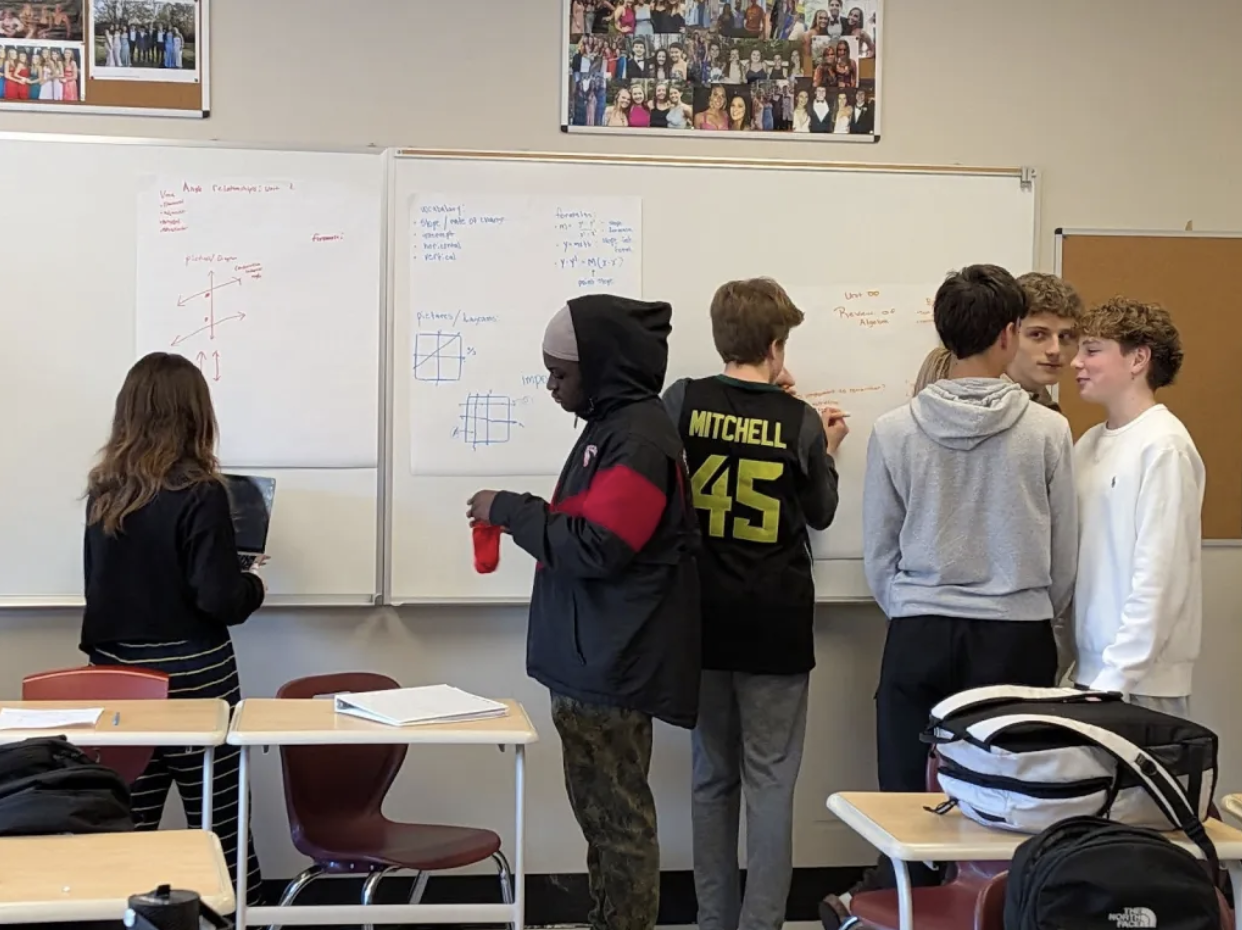 Students doing geometry activity on whiteboards