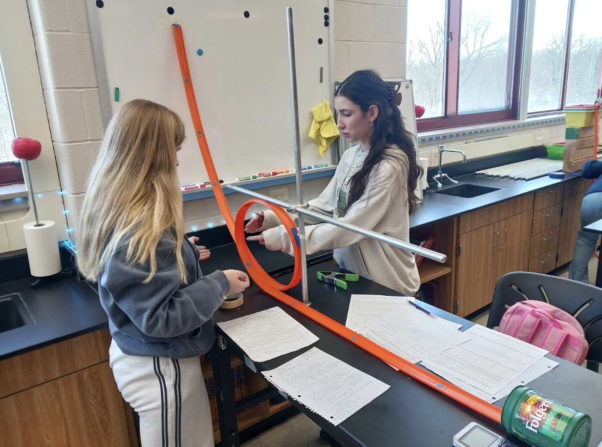 Physics students working on lab