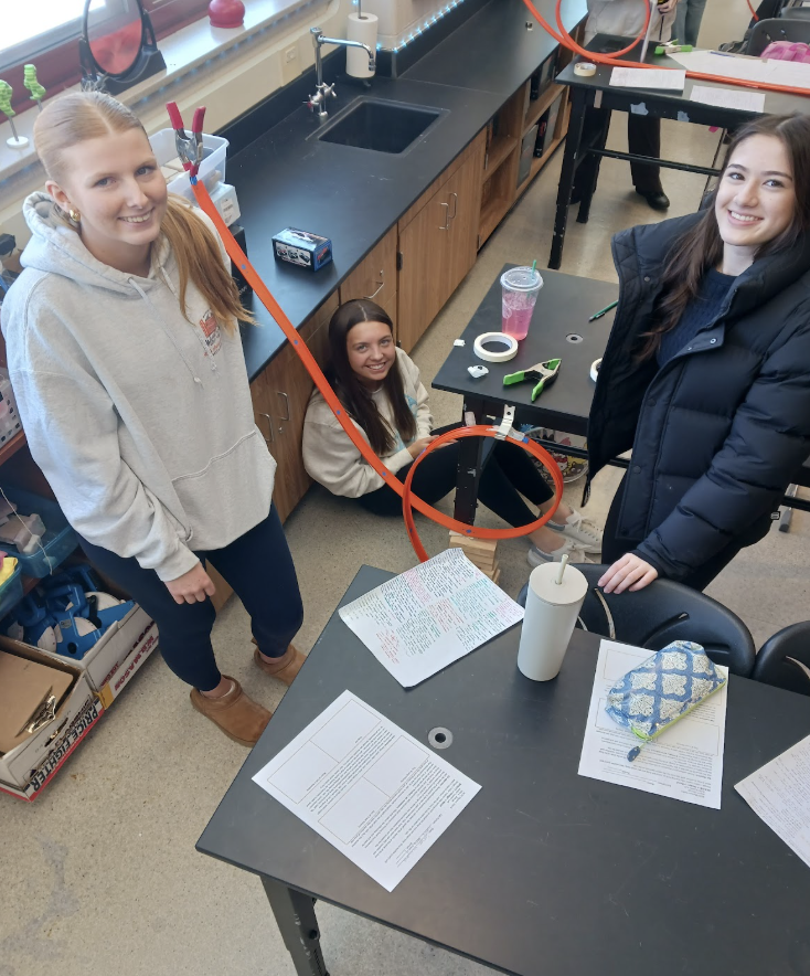Physics students working on lab