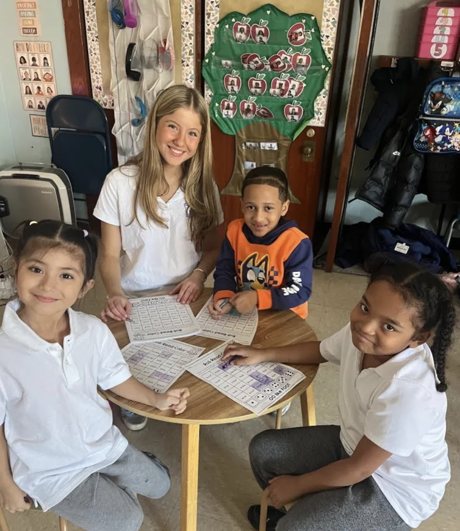 NHS student with the kids