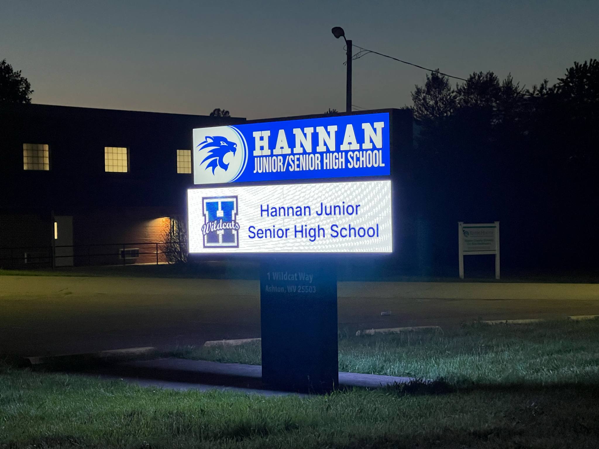 School new sign at night