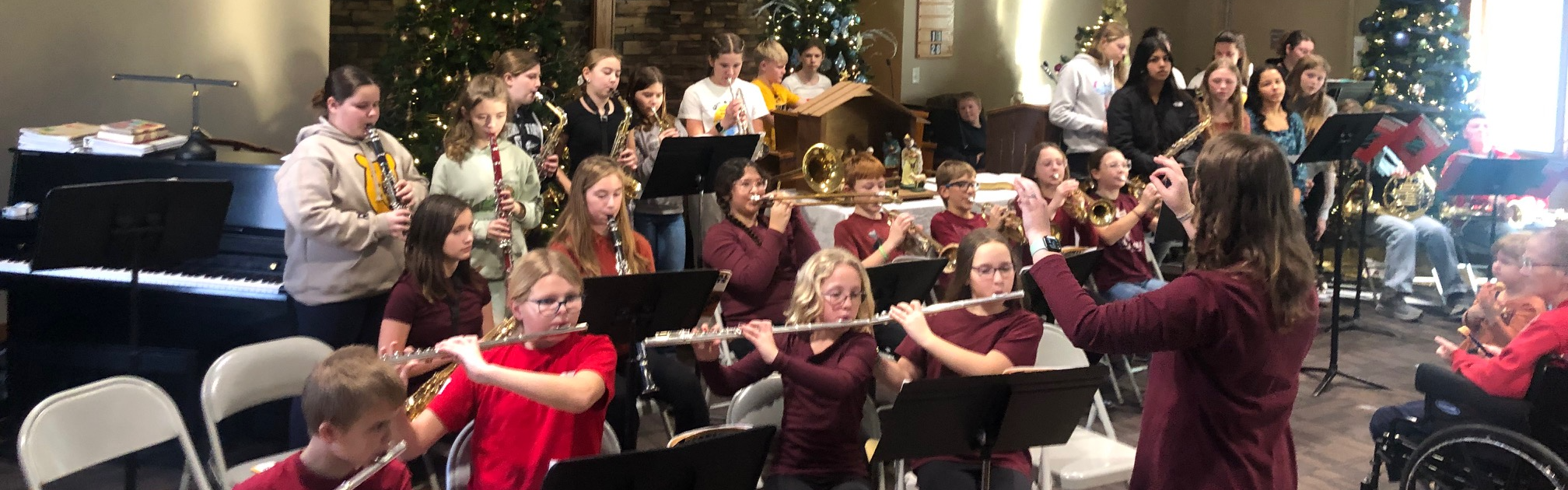 Students playing instruments at nursing home
