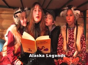 photo of students in costumes reading a book