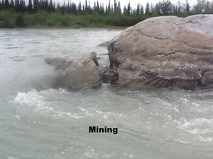 photo of a rock in the water