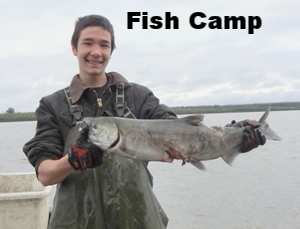 photo of a student holding up a fish