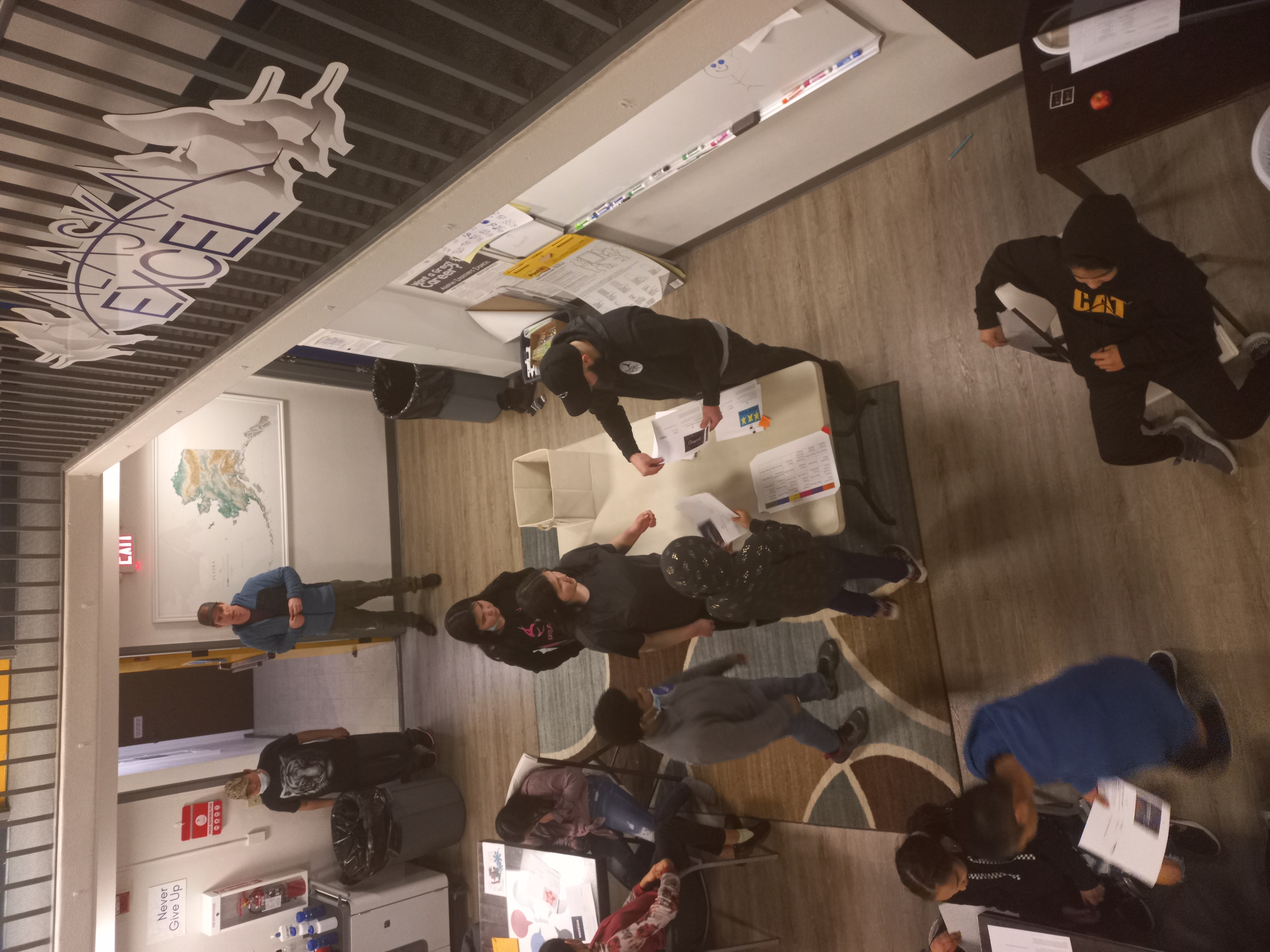 overhead shot of students working indoors at desks