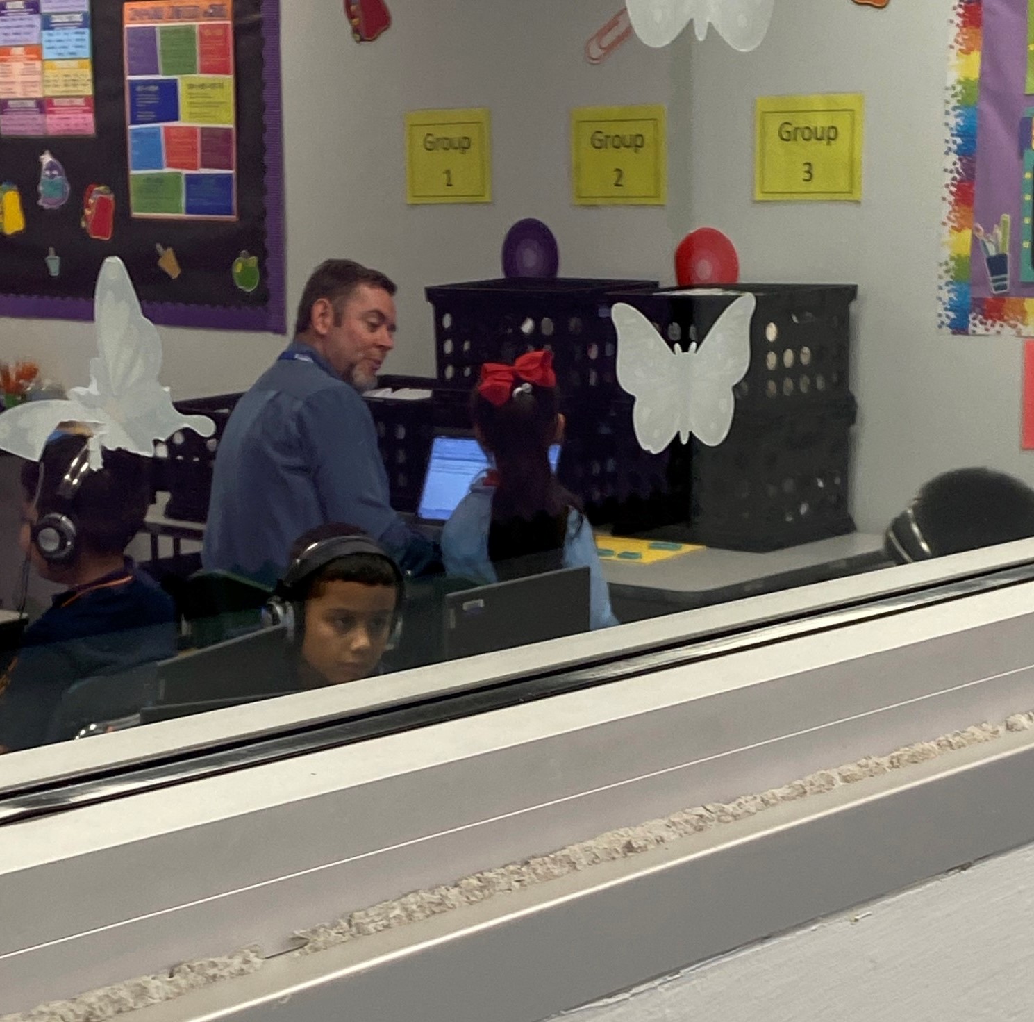 Mr. Unruh helping in a teacher's classroom