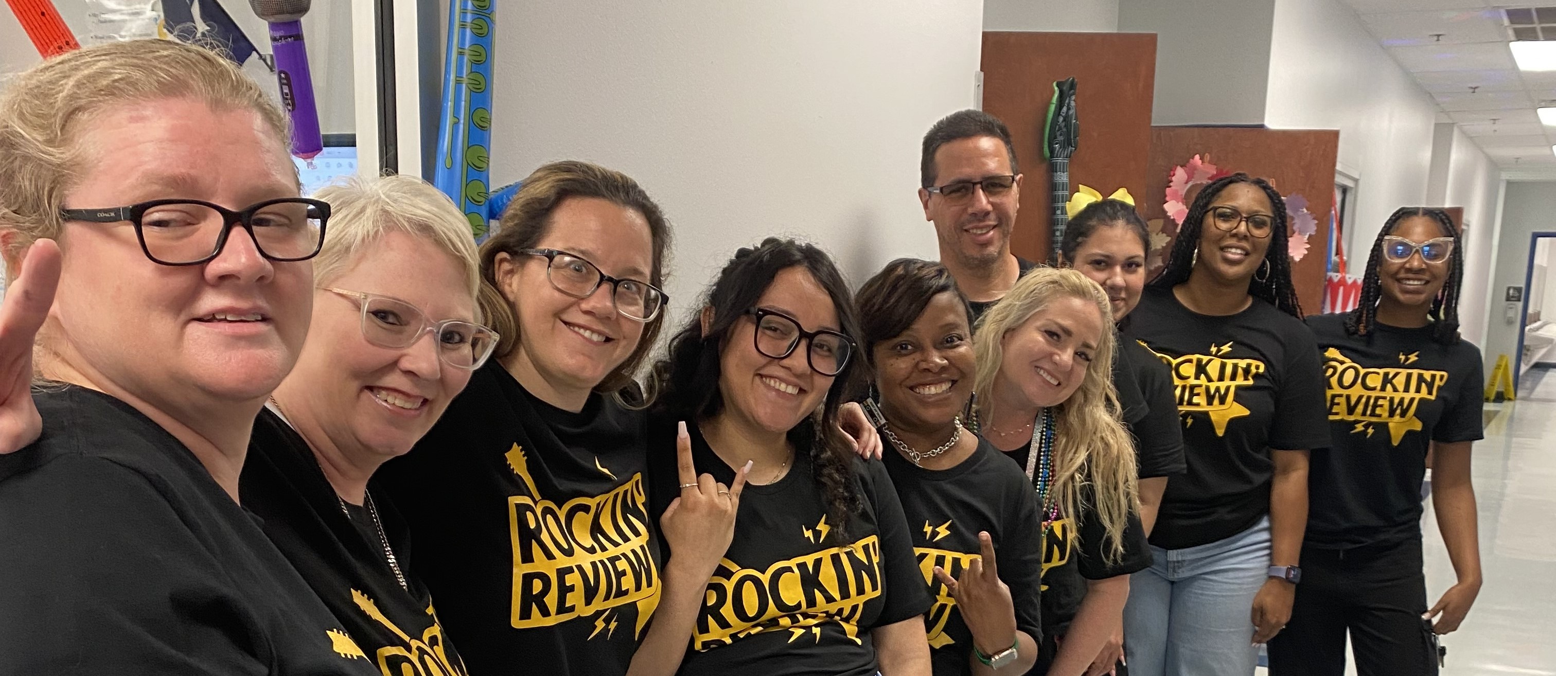 STAAR Rockin' Review T-Shirt Staff Line-up: Staff Members Behind  One Another in a Line