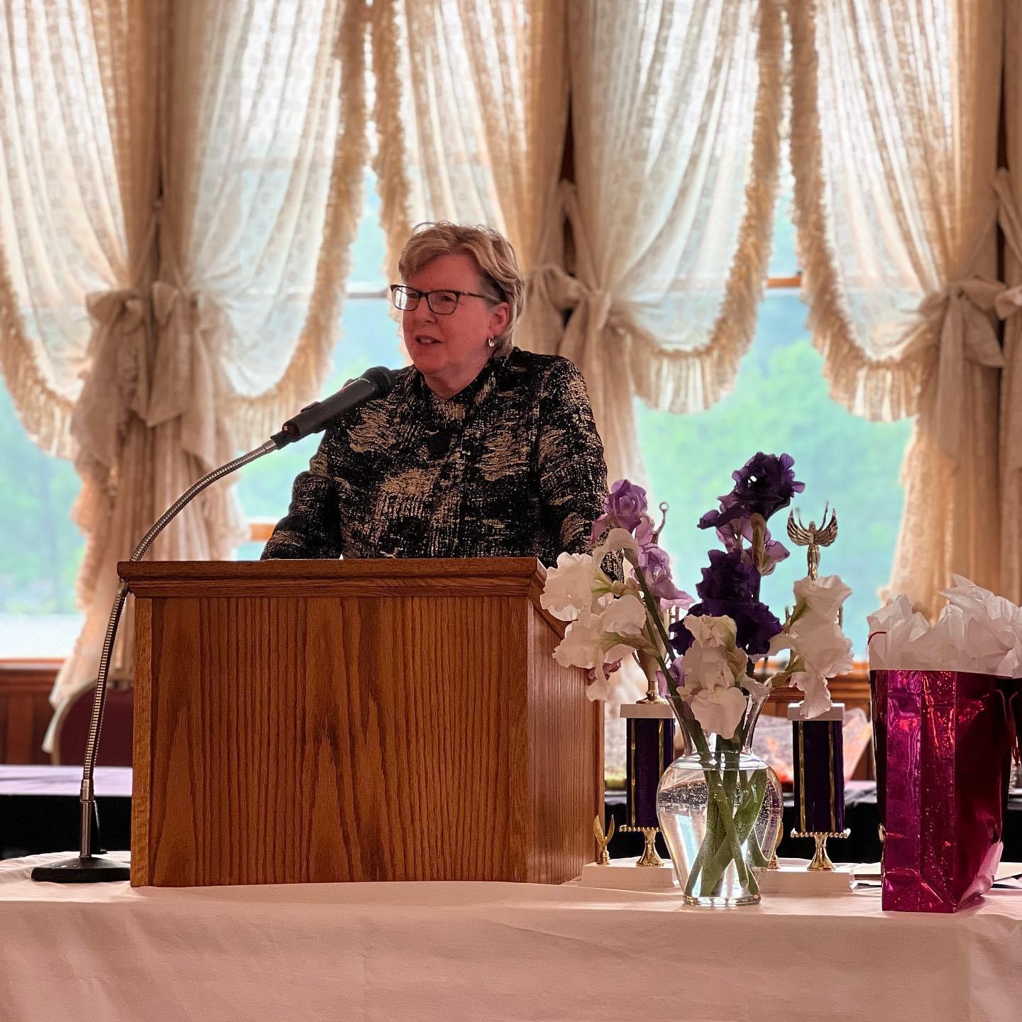 speaker standing at podium