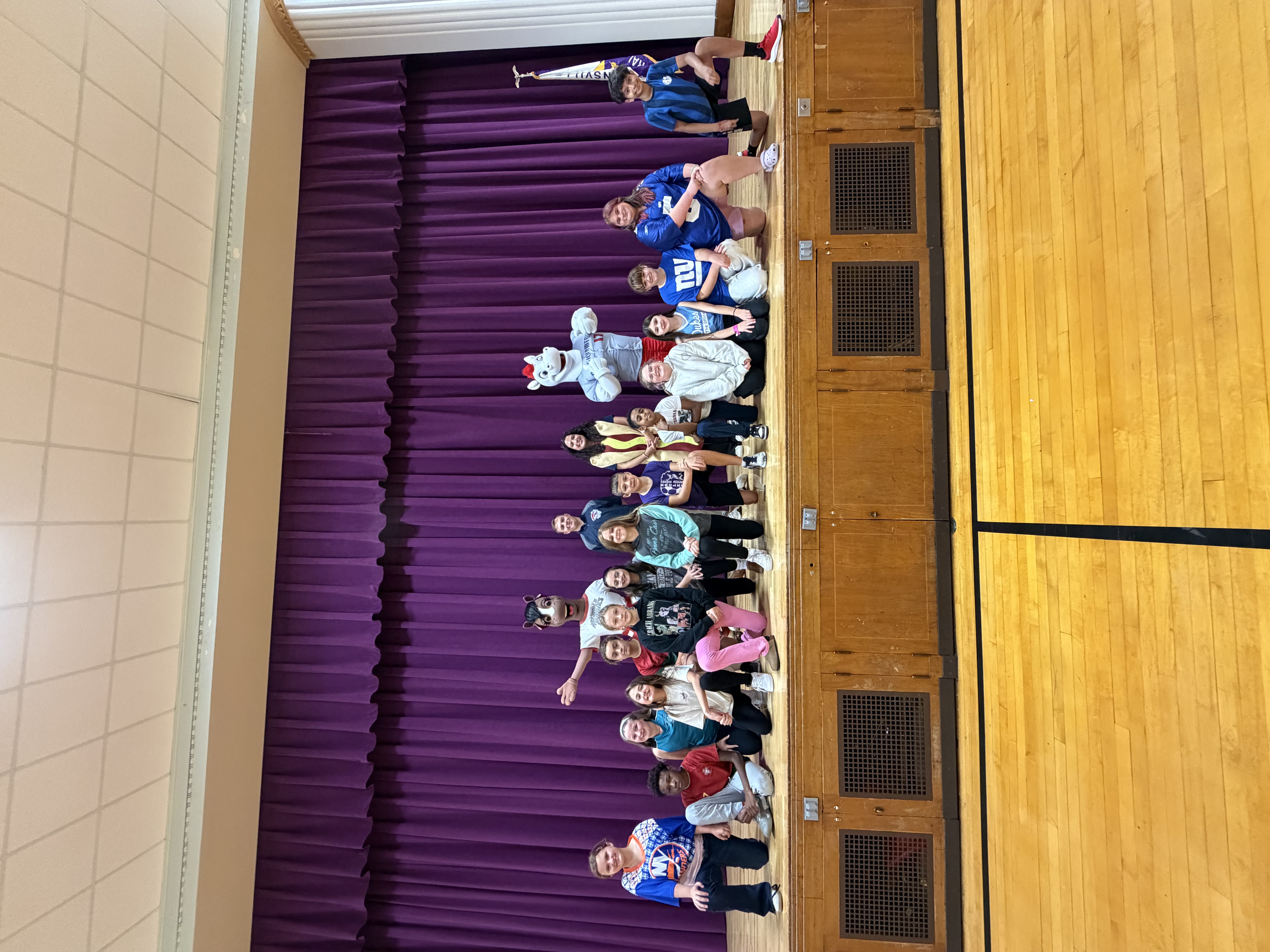 students on stage with mascots