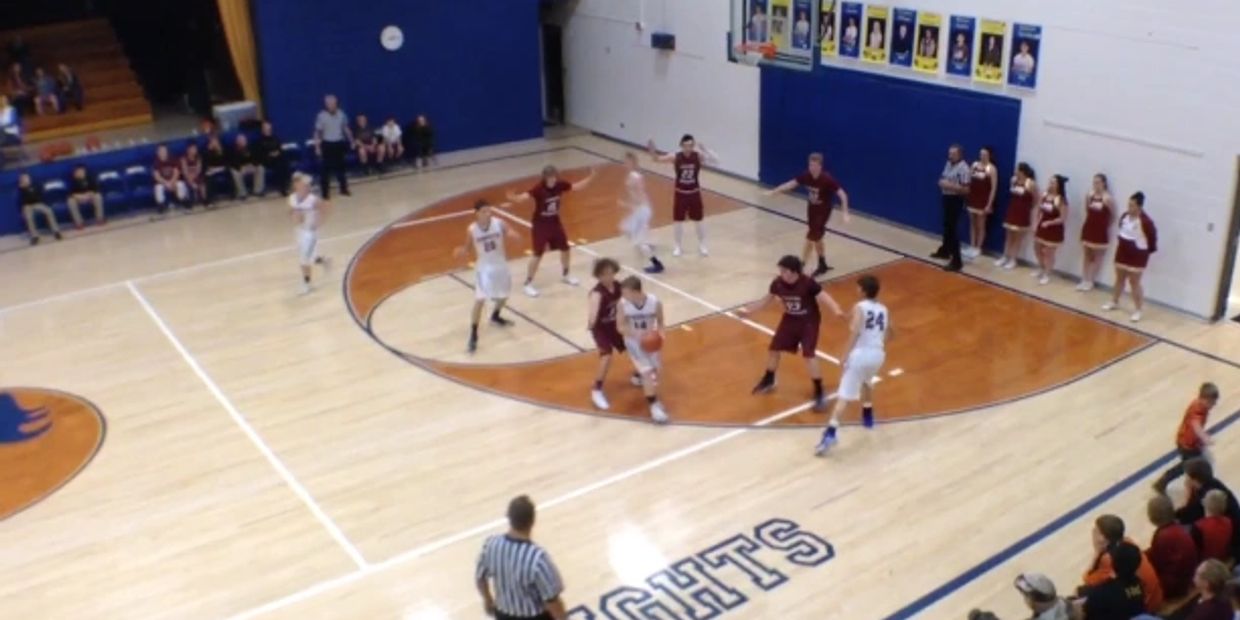 Two boys basketball team playing basketball