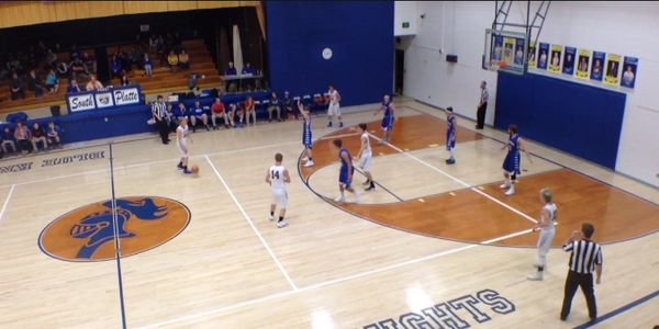 South Platte boys basketball team playing basketball on their home court