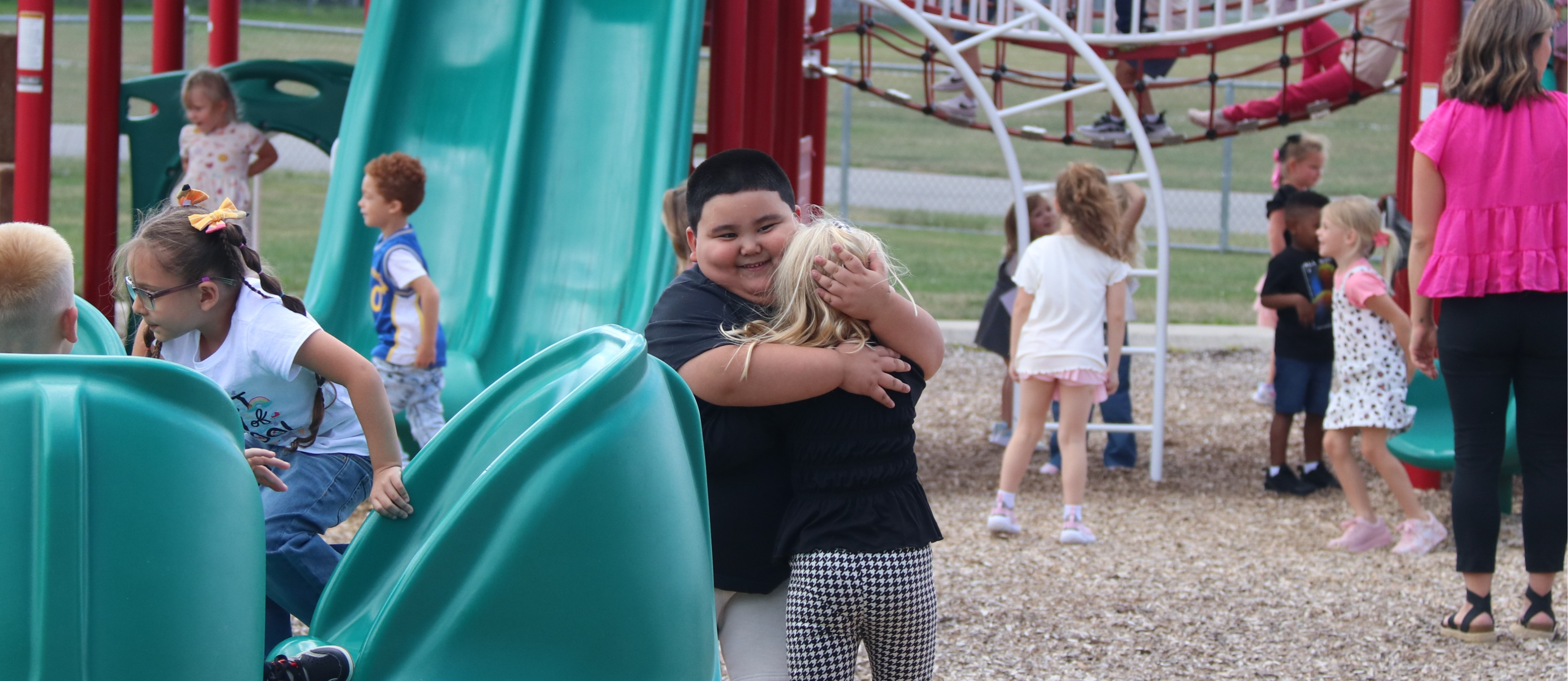 students hugging