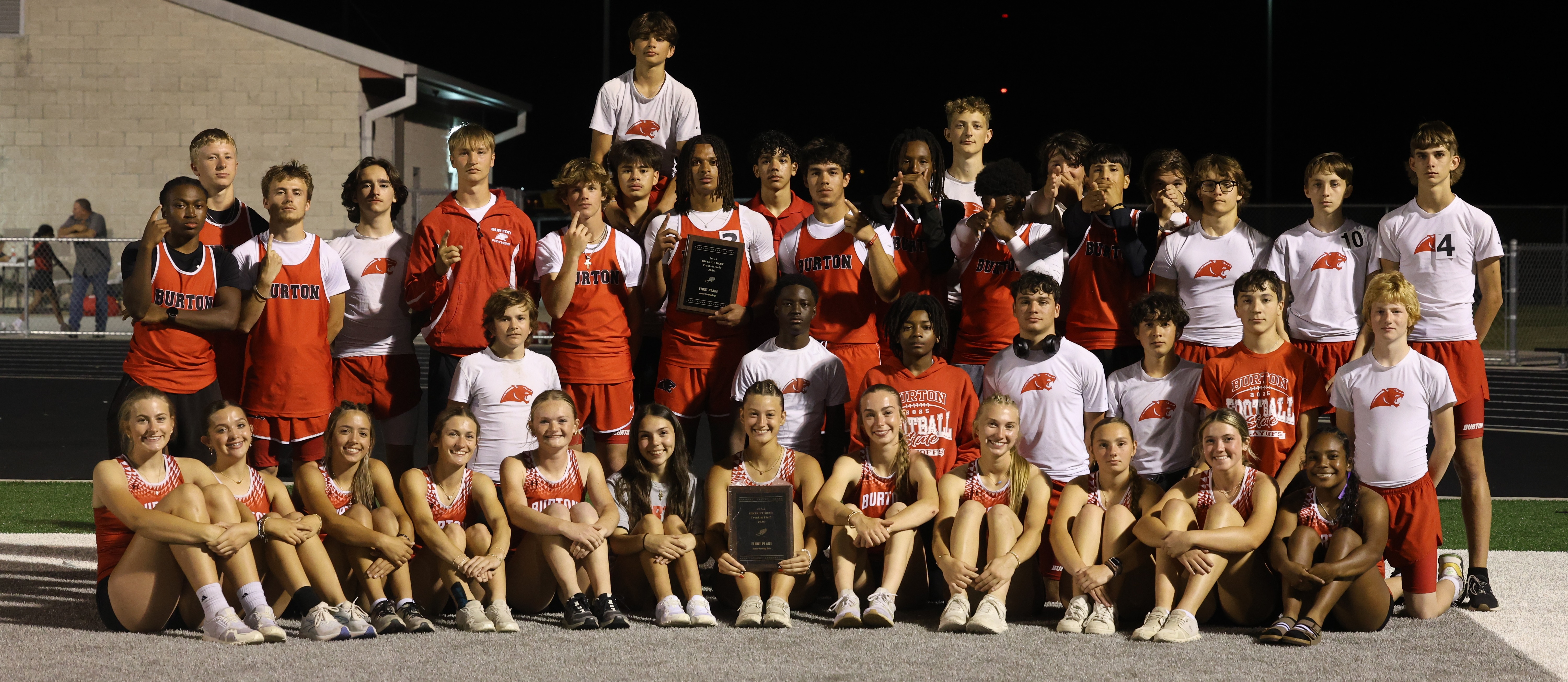 Group of students wearing track uniforms